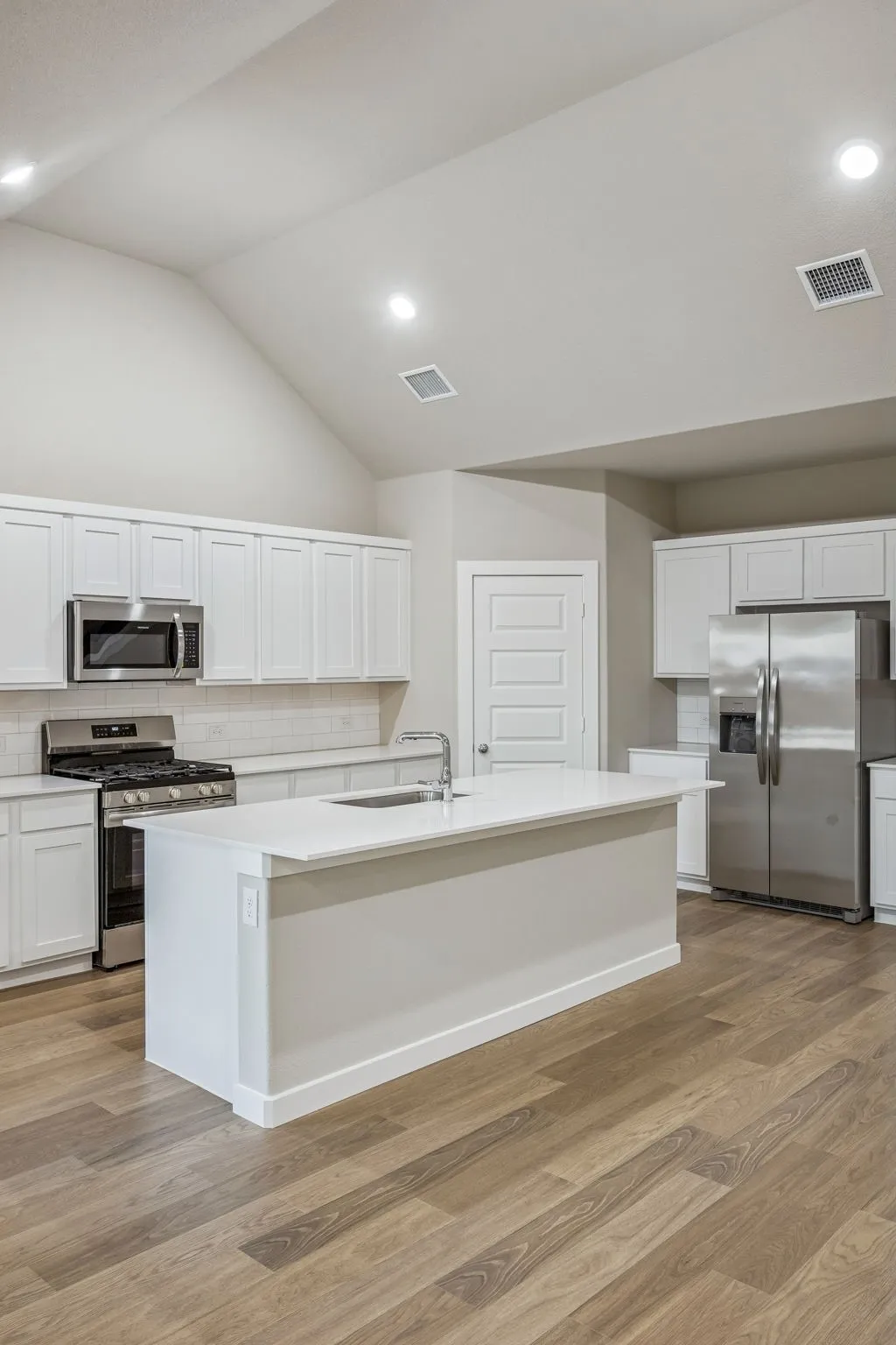 Kitchen in the Wimbledon home plan by Trophy Signature Homes – REPRESENTATIVE PHOTO