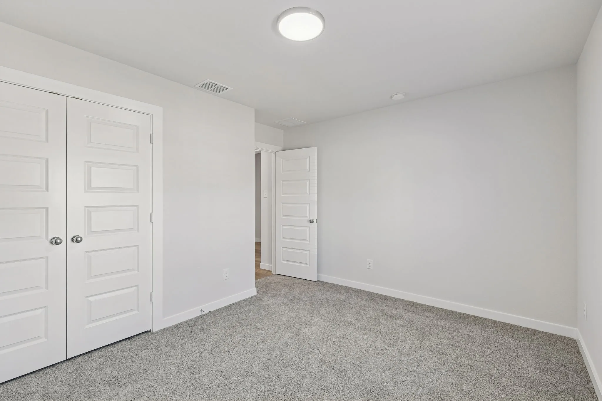Bedroom in the Harrison home plan by Trophy Signature Homes – REPRESENTATIVE PHOTO