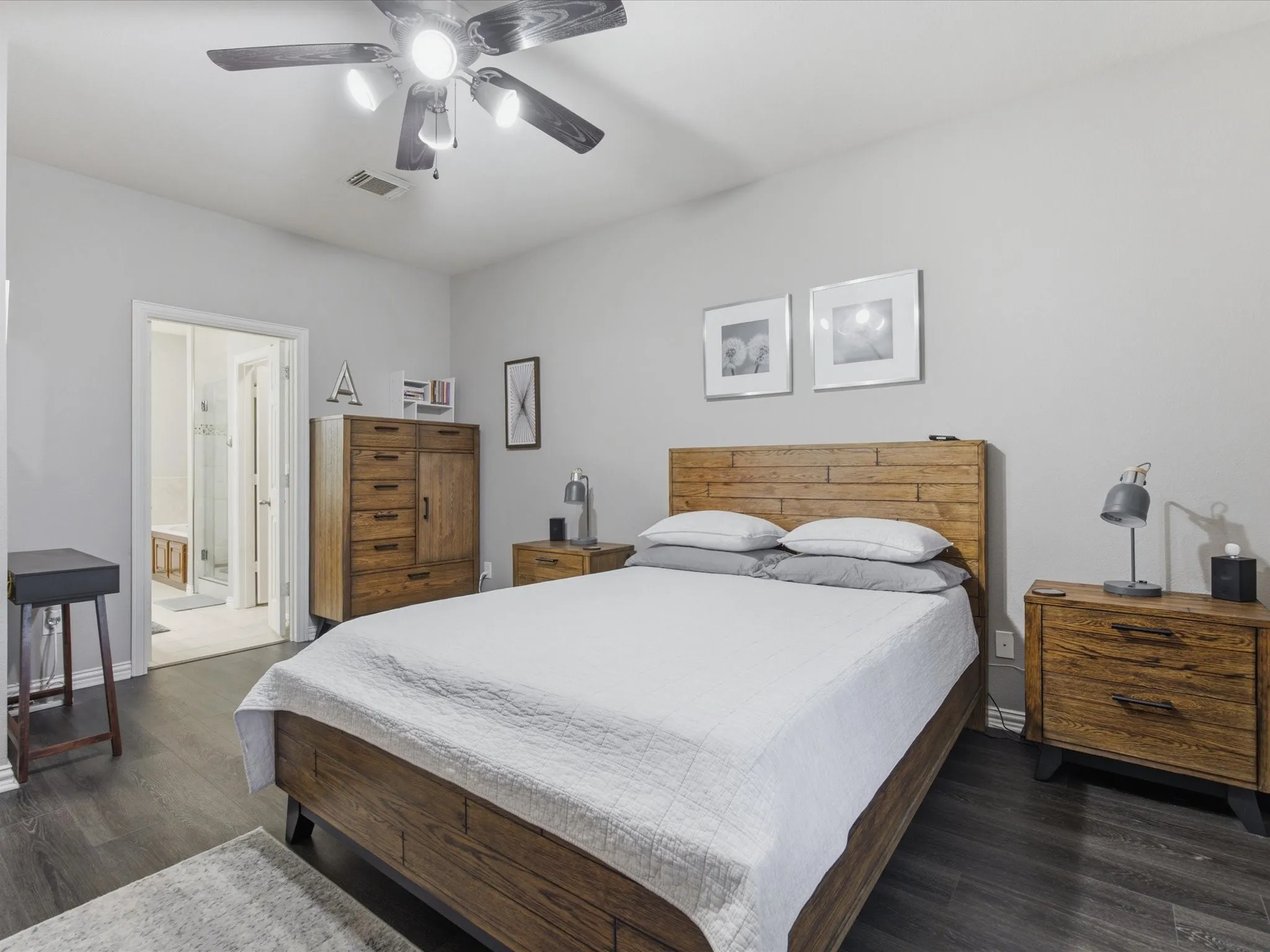 Primary Bedroom featuring wood-finish flooring, a ceiling fan with integrated lighting, and light-toned wall paint
