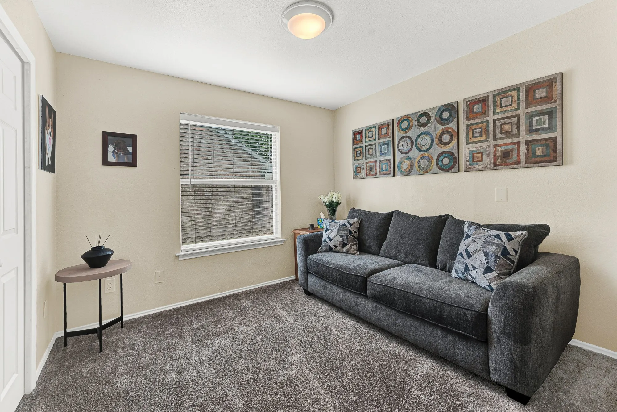 This room is a flex bedroom or potential office space with the half bath just outside the door
