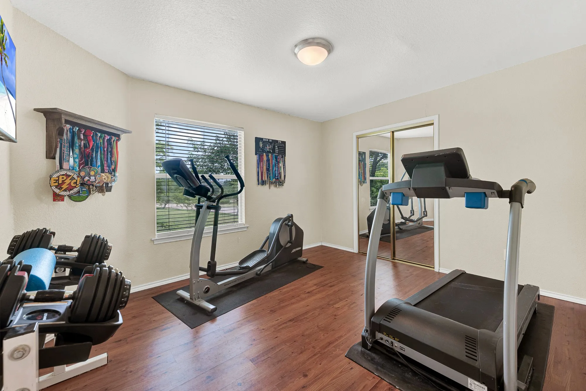 This secondary bedroom is currently used a gym space.