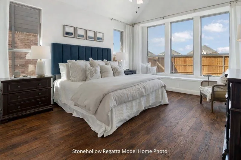 Primary Bedroom is on the first floor and has lots of windows  **real wood flooring is in 4336 Westminster**
