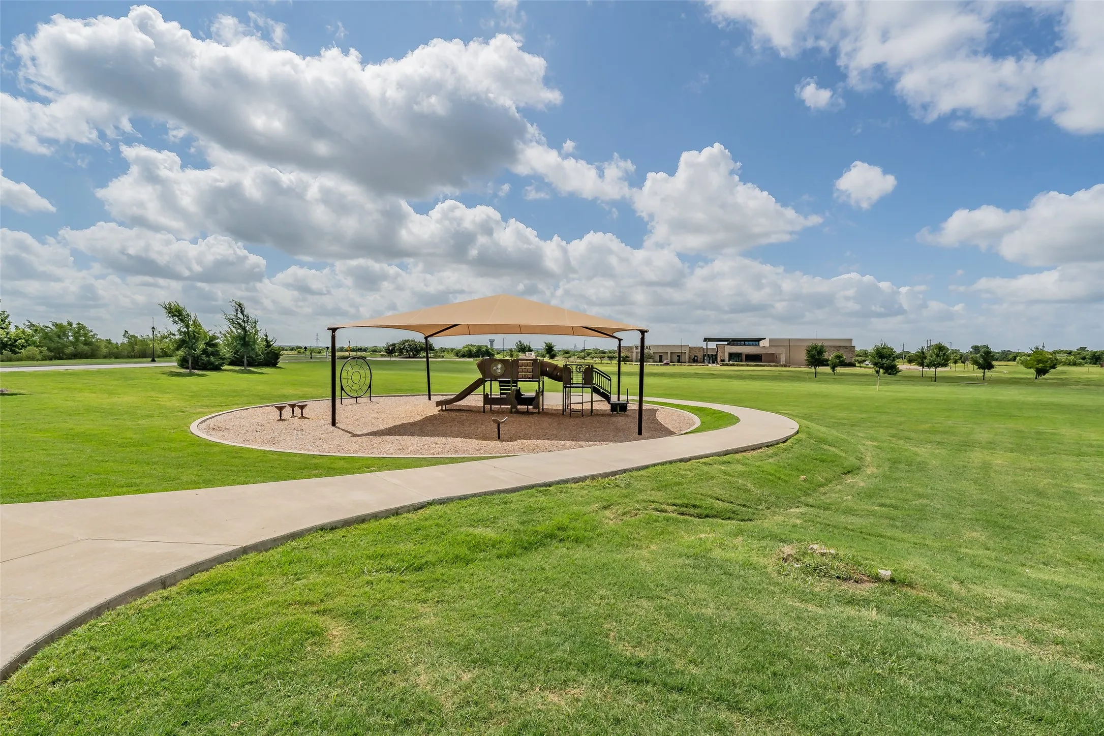 Just one of the several covered parks located walking distance from home. With open greenbelts space to run and play.