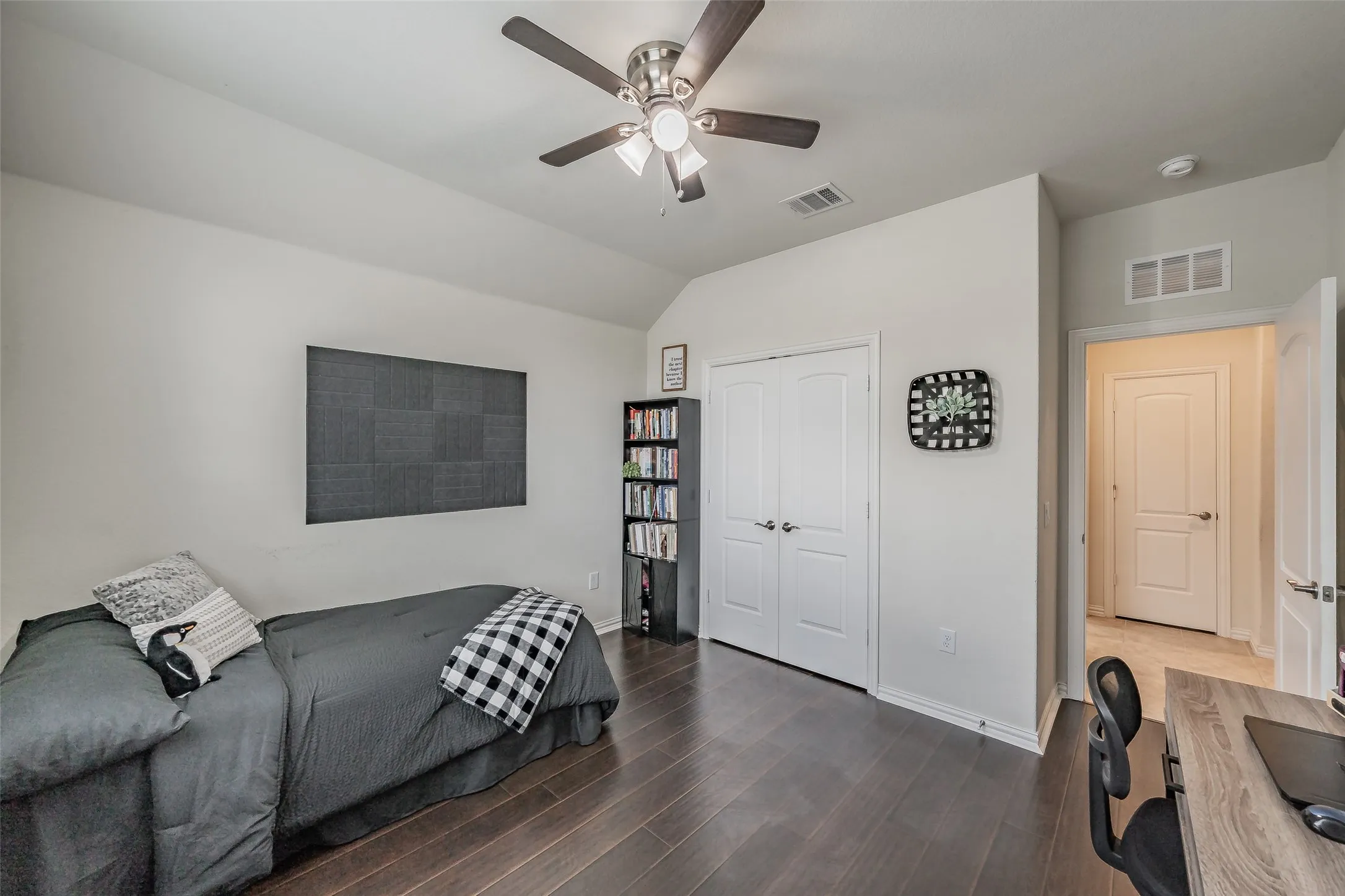 Another view of same bedroom featuring a walk in closet