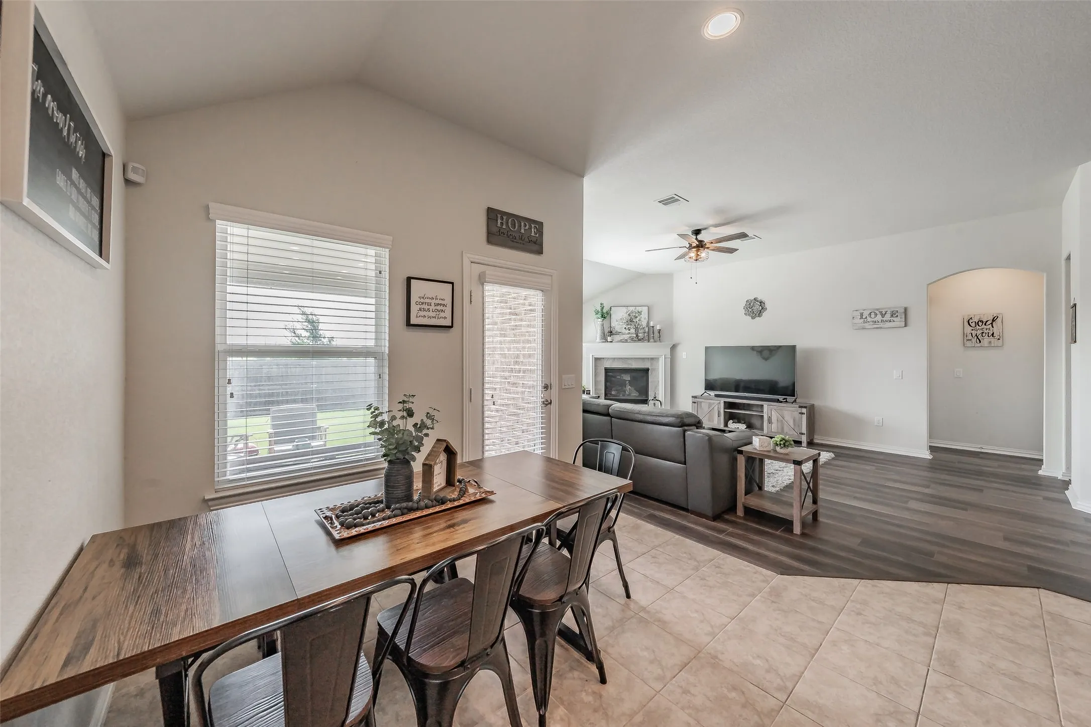 Open concept breakfast area with natural lighting and ceramic tile floors