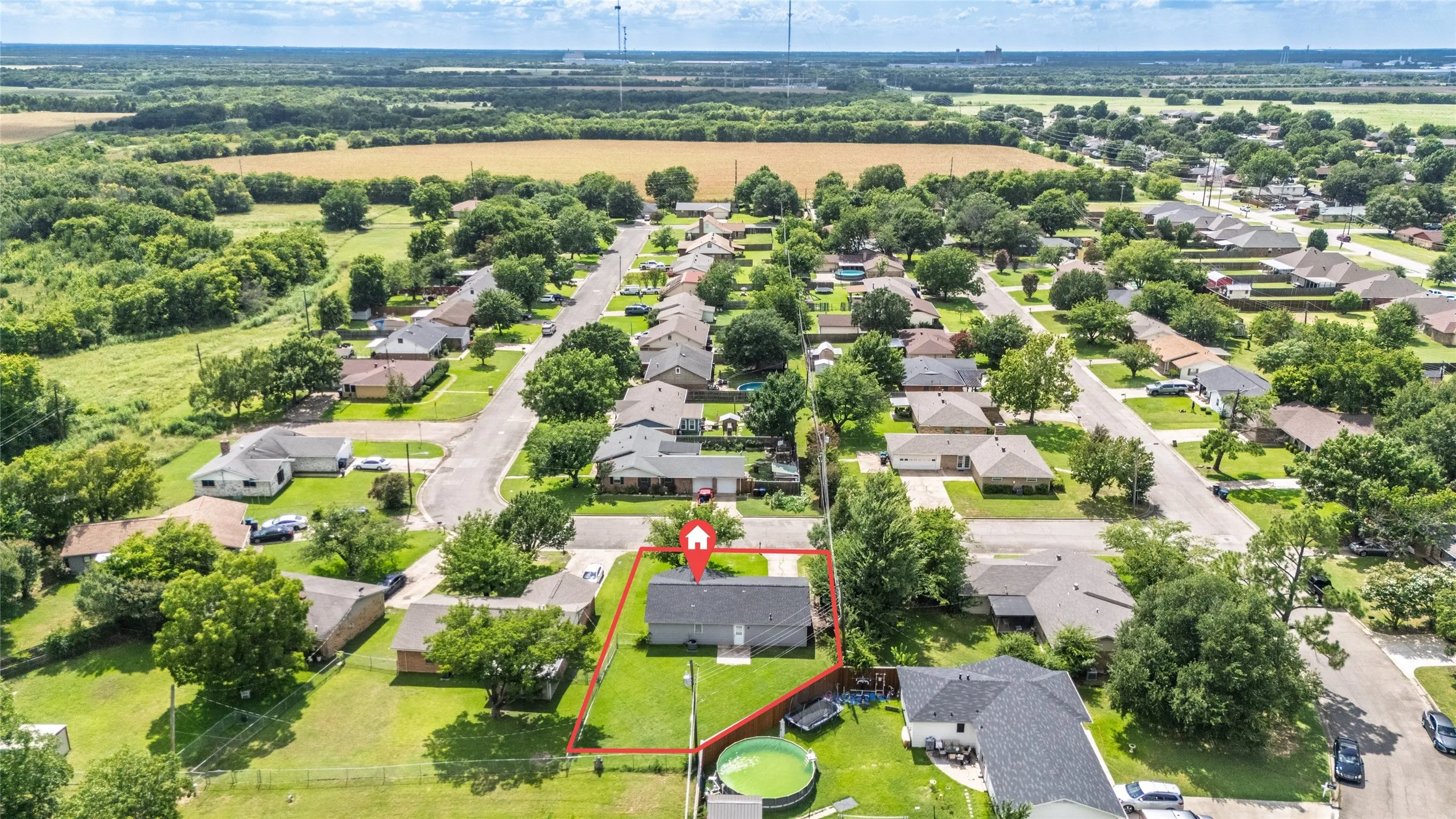 Aerial view of a residential neighborhood with a suburban street layout