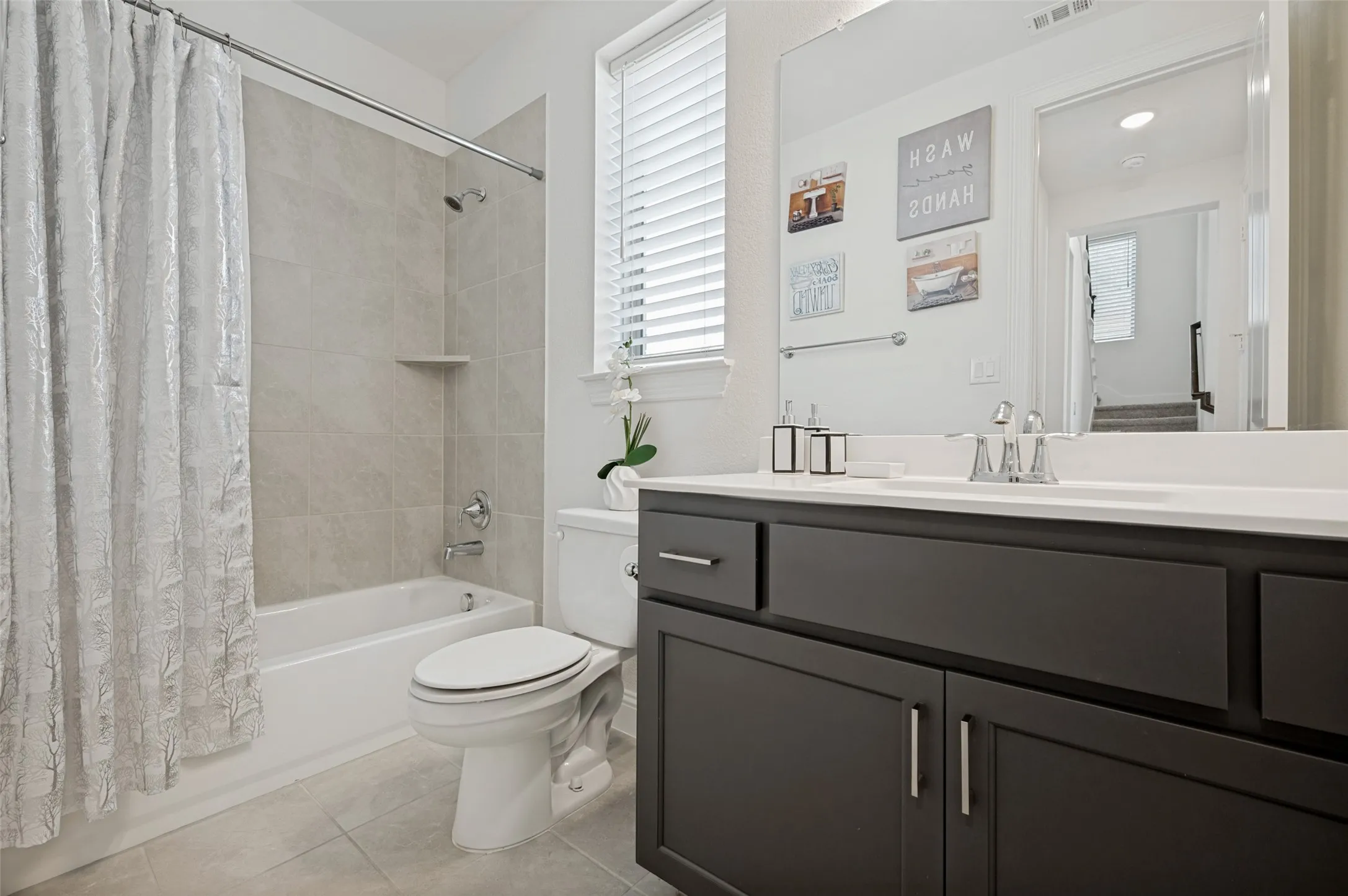 Separated first floor bedroom and full bath would be perfect for multi-generational living or a guest suite.