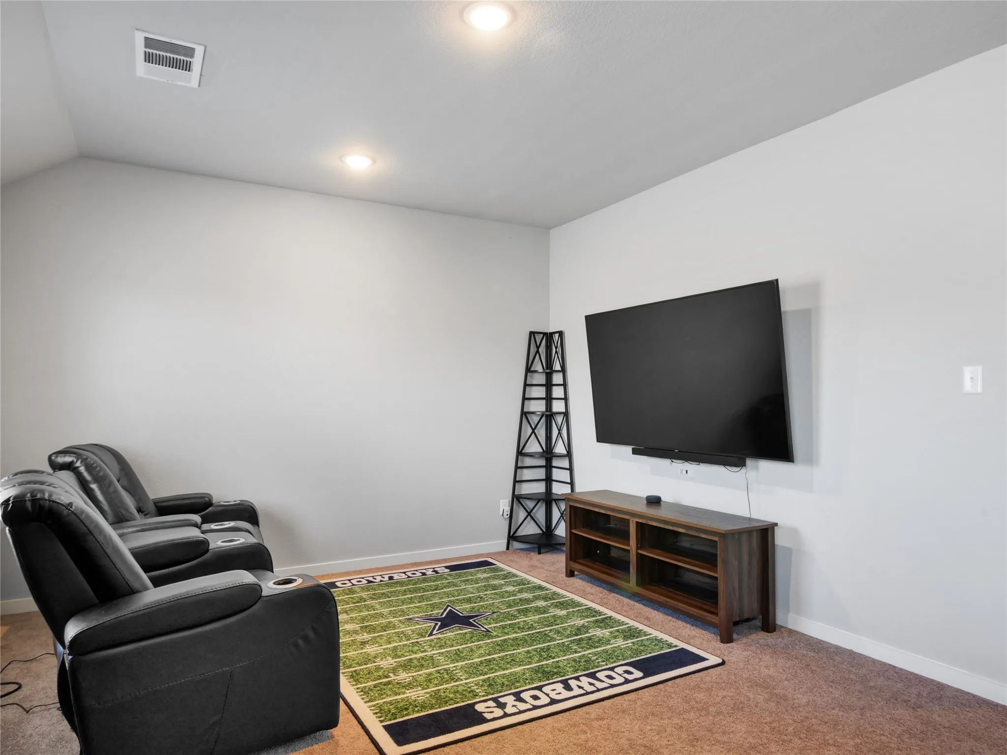 Carpeted room with recessed lighting and light gray walls