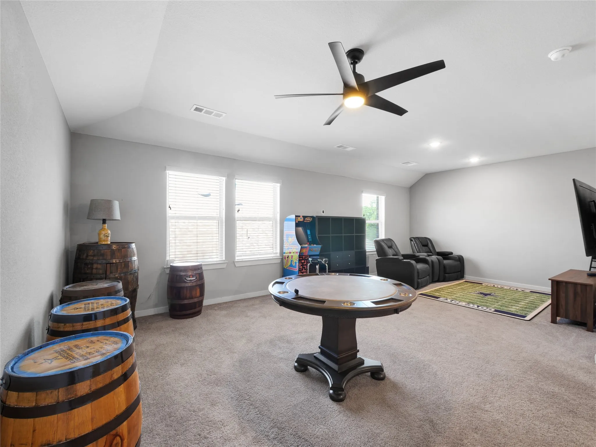 Carpeted room with recessed lighting and light gray walls