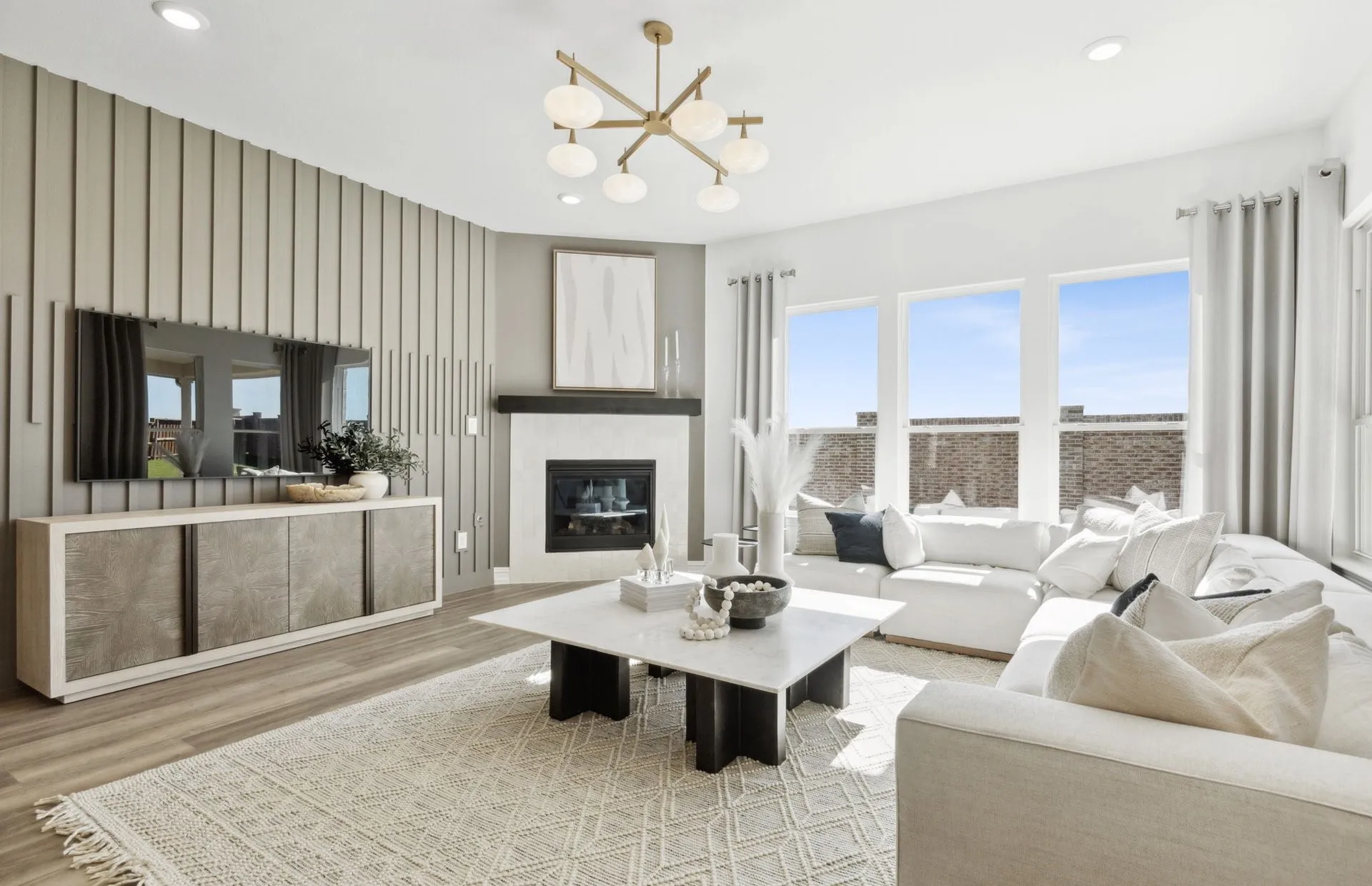 *Model Representation - Spacious gathering room with large windows