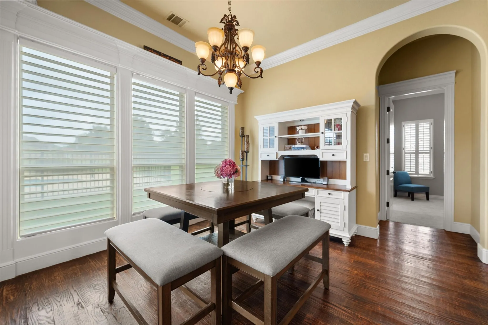 Dining area featuring wood-finish flooring, and a decorative chandelier
