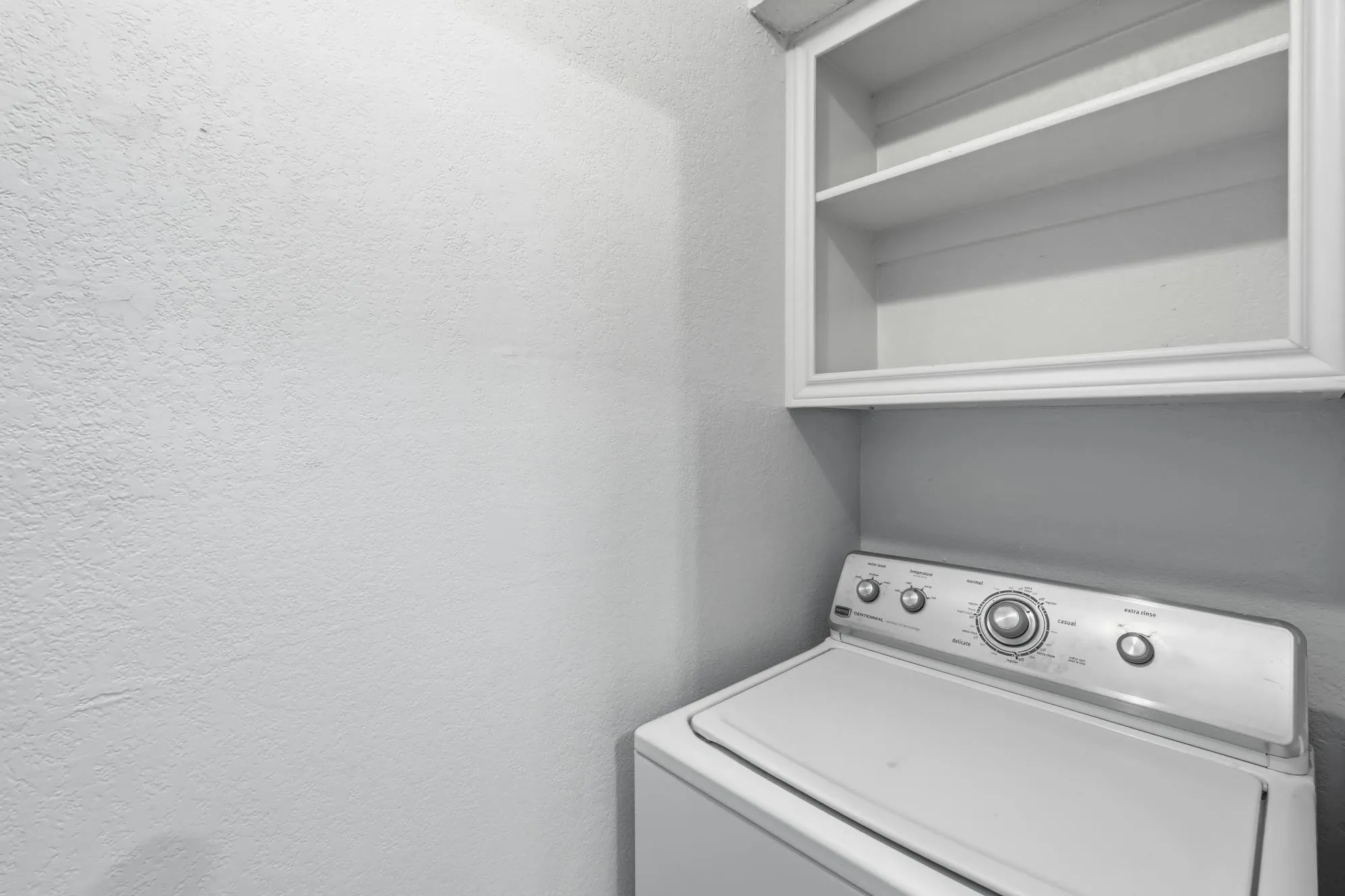 Built-in upper shelving unit providing storage
