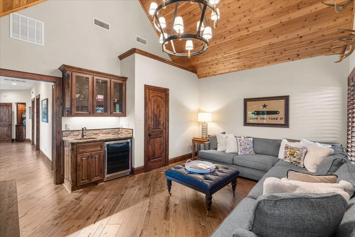TV room with wet bar. Could also be 5th bedroom