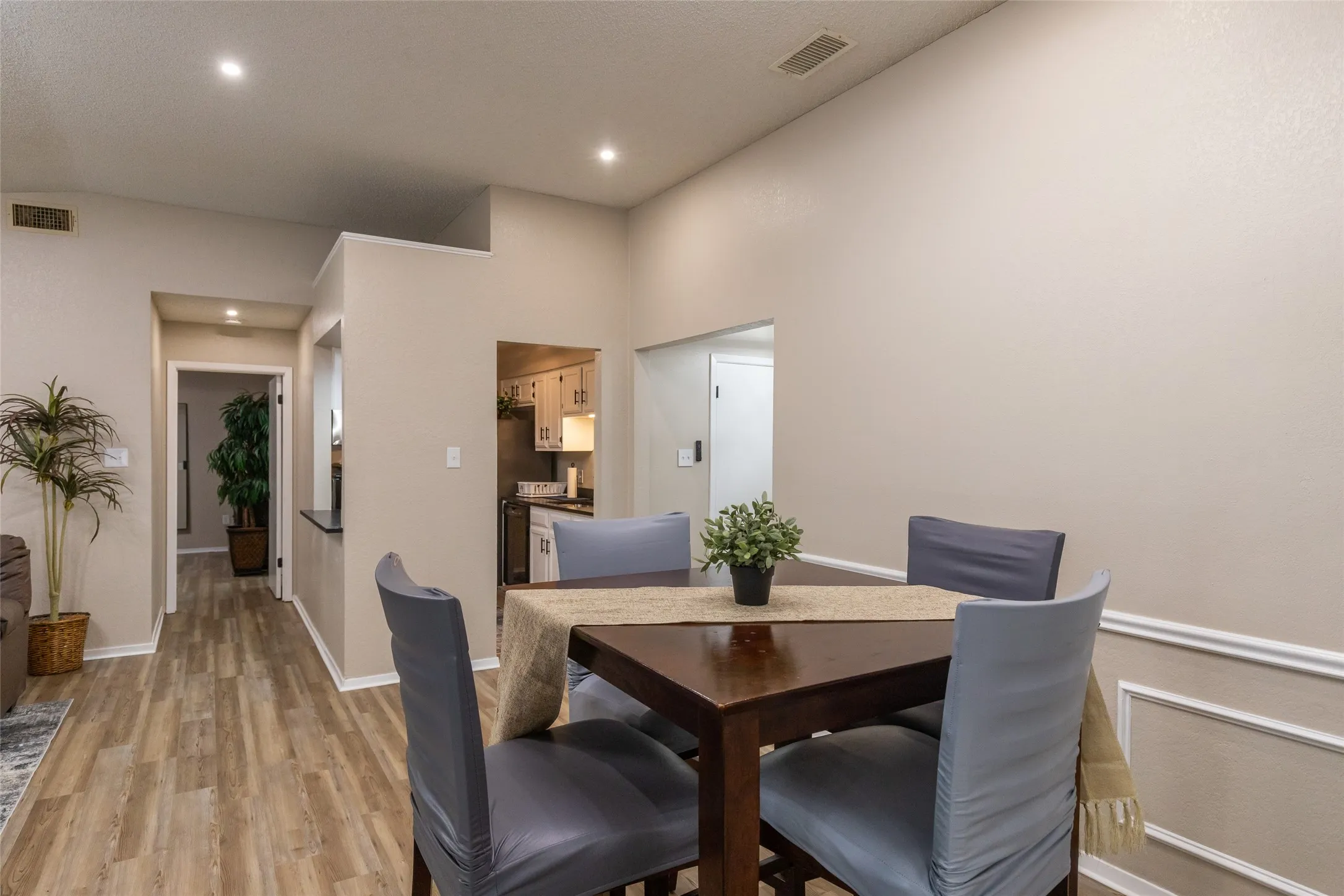Dining area featuring a vaulted ceiling and recessed lighting