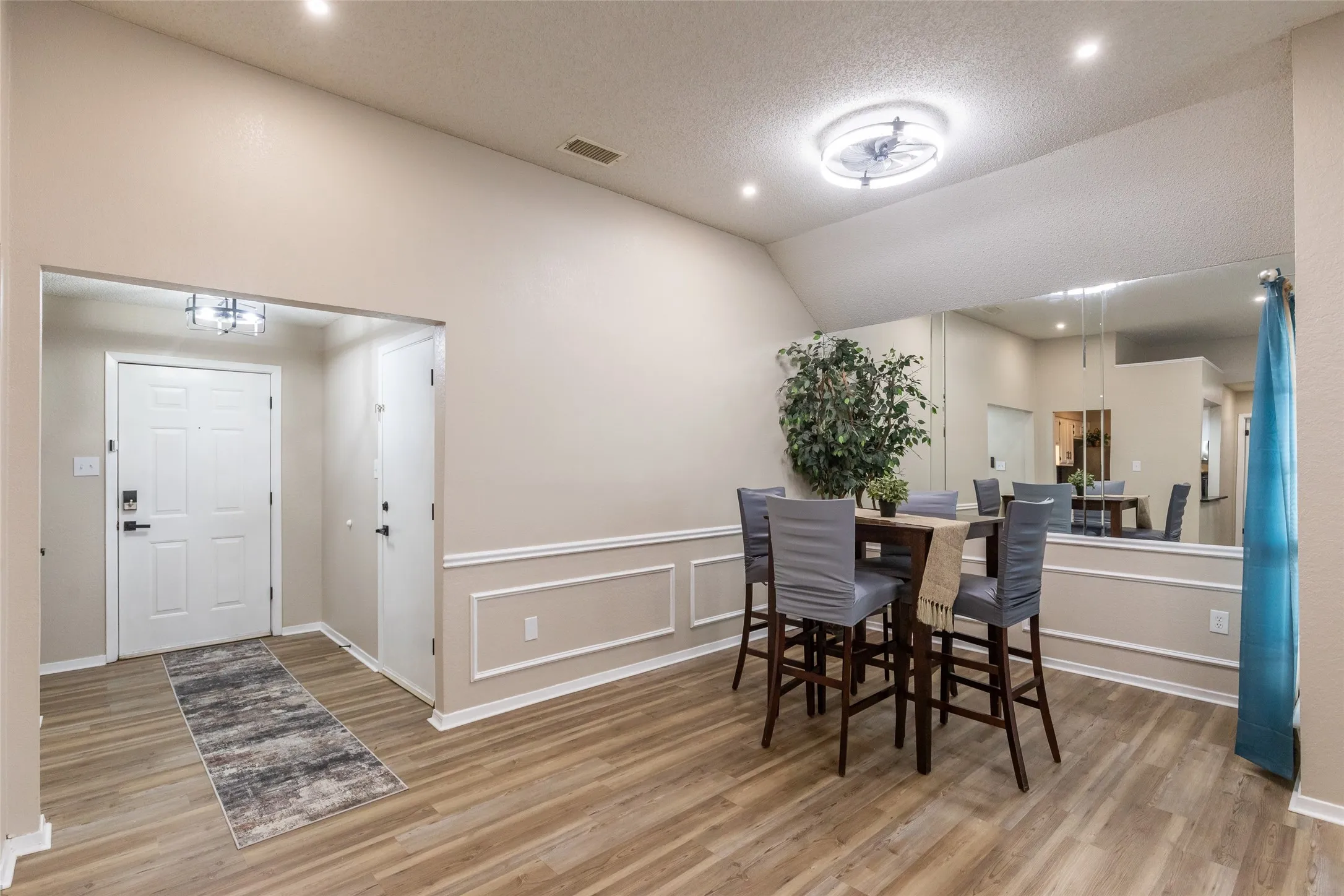 Vaulted ceilings over wood-finish flooring