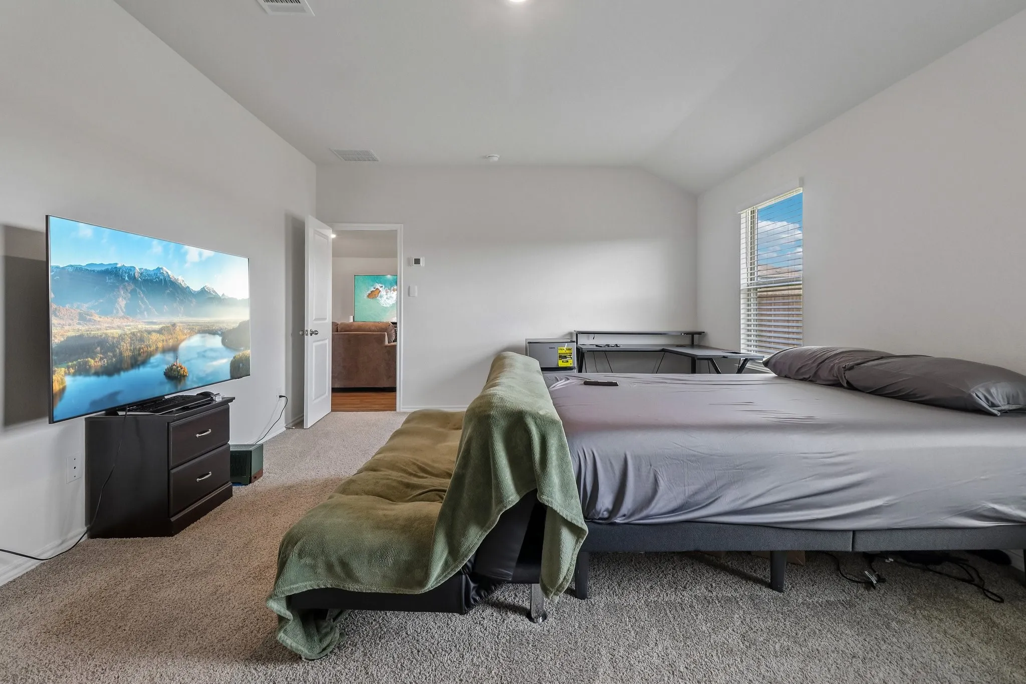 Carpeted room with white walls and a white ceiling