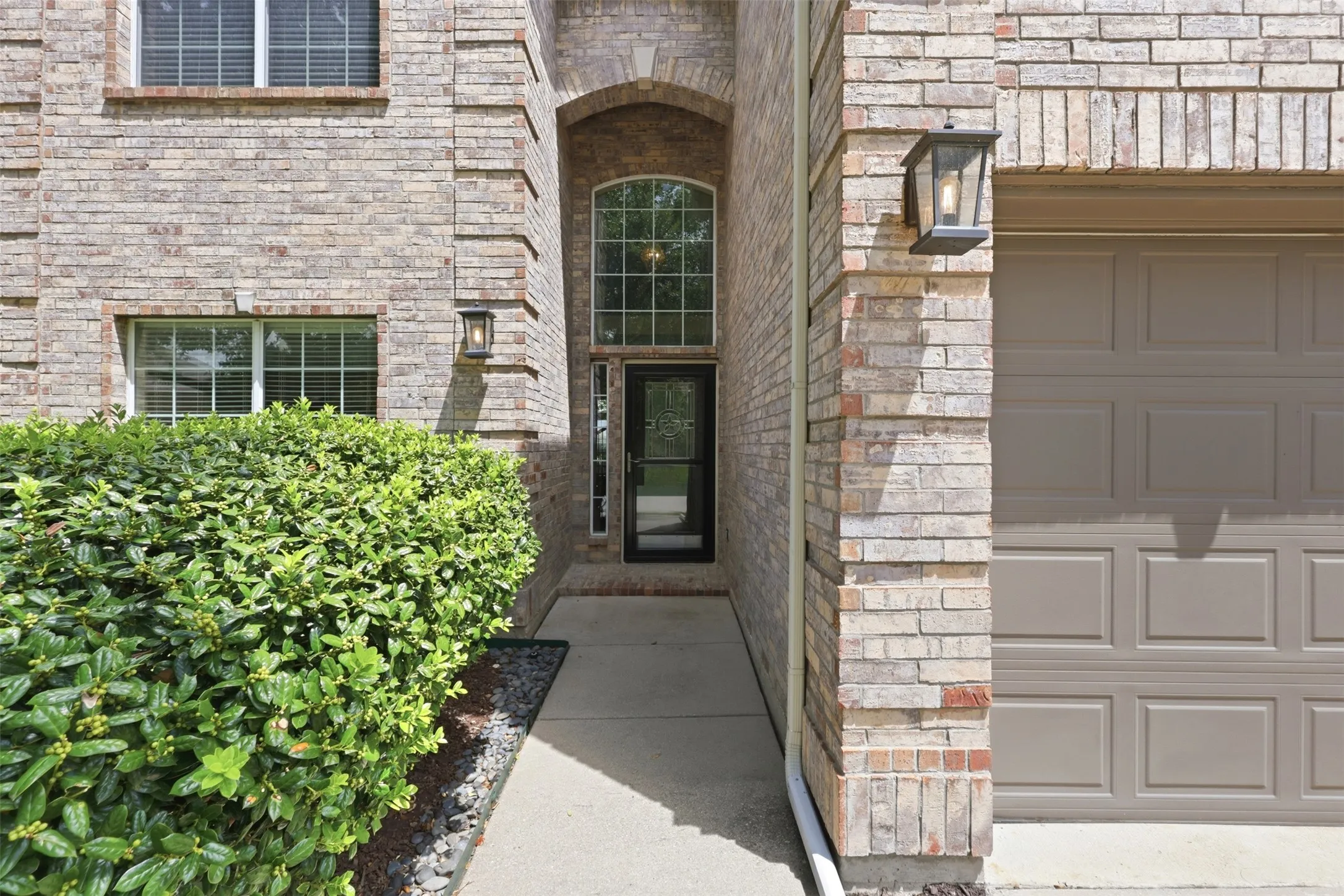 Glass Storm door allows for extra security and natural light into the home.