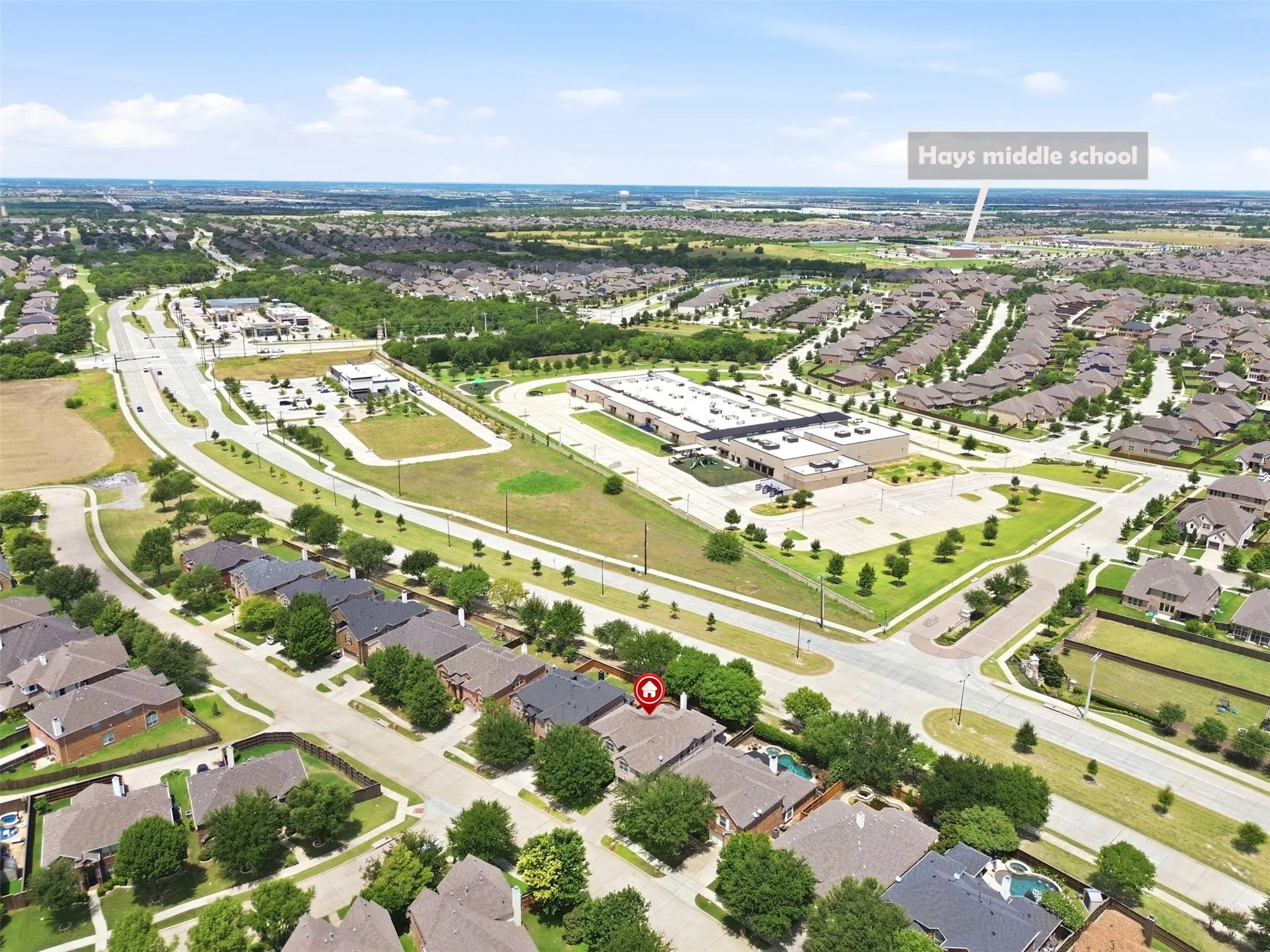 Aerial perspective showcasing the residential neighborhood and surrounding infrastructure