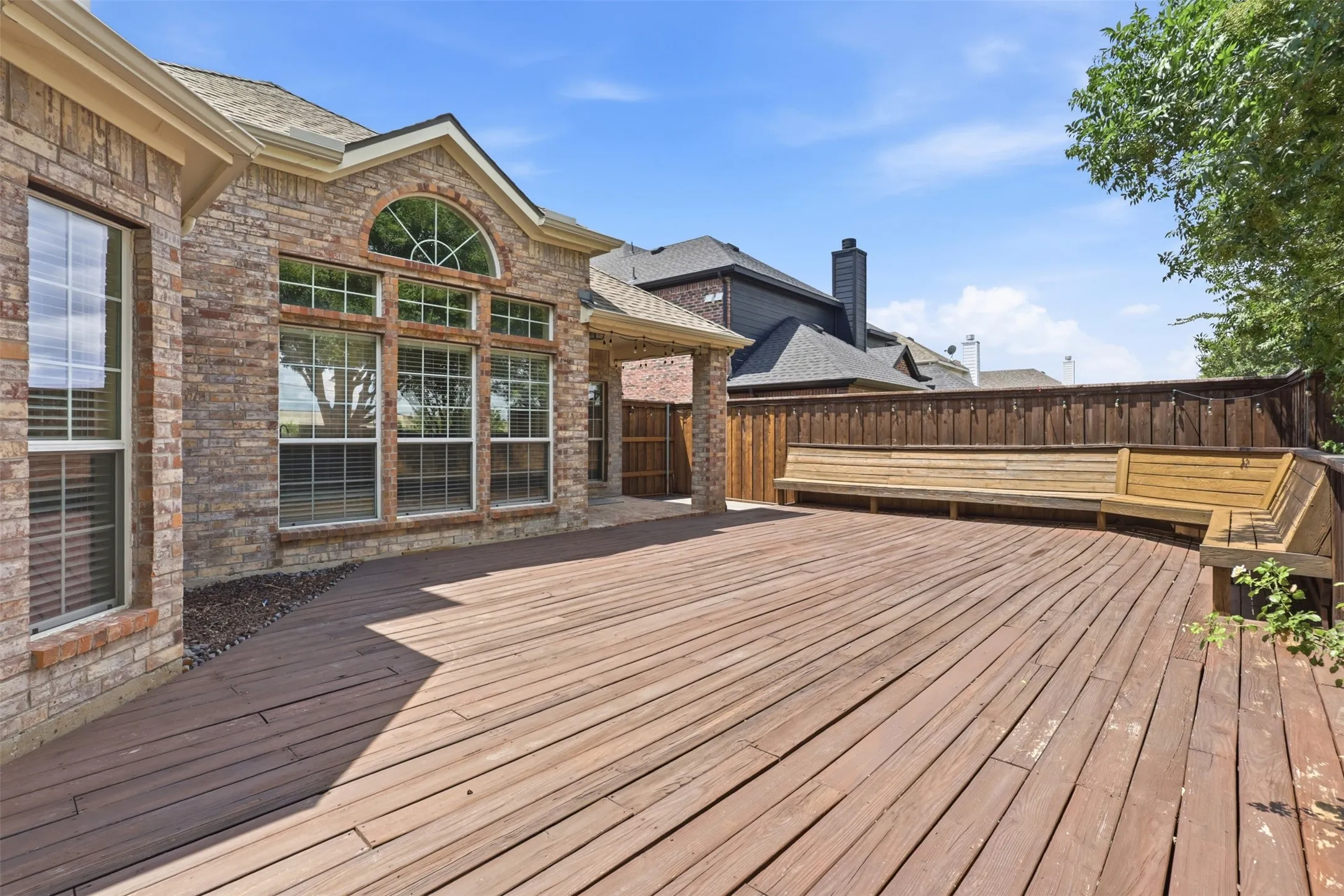 Alternate View of Deck looking towards bench-seating and covered porch.
