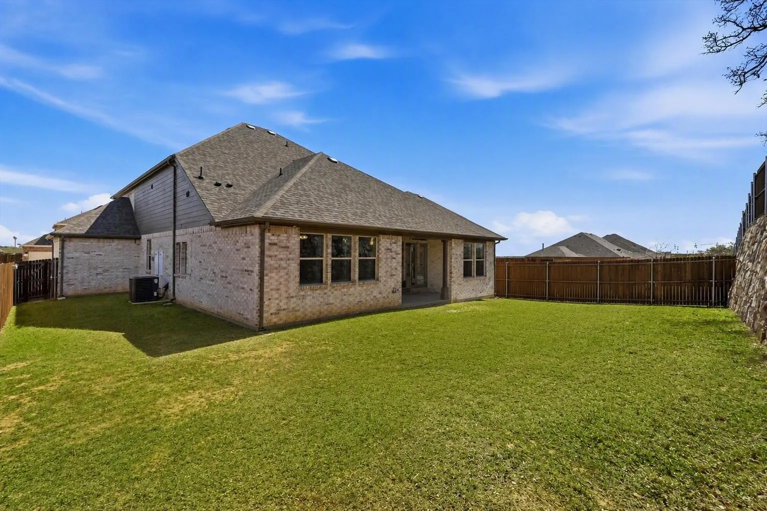 Expansive backyard with a privacy fence