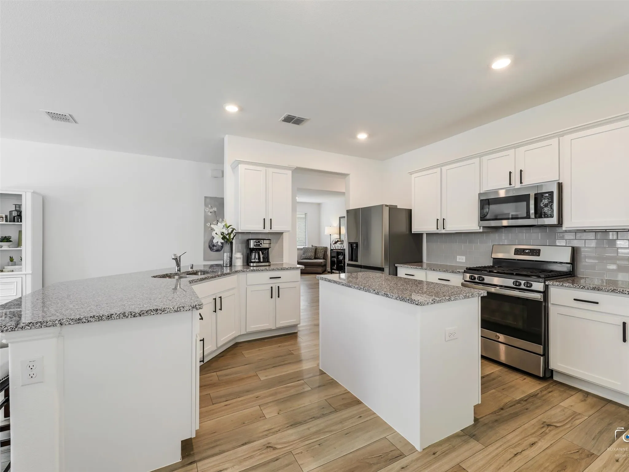 Appointed with 36" upper wall cabinetry with Crown molding.  3 CM Granite countertops and stainless double undermount sink
