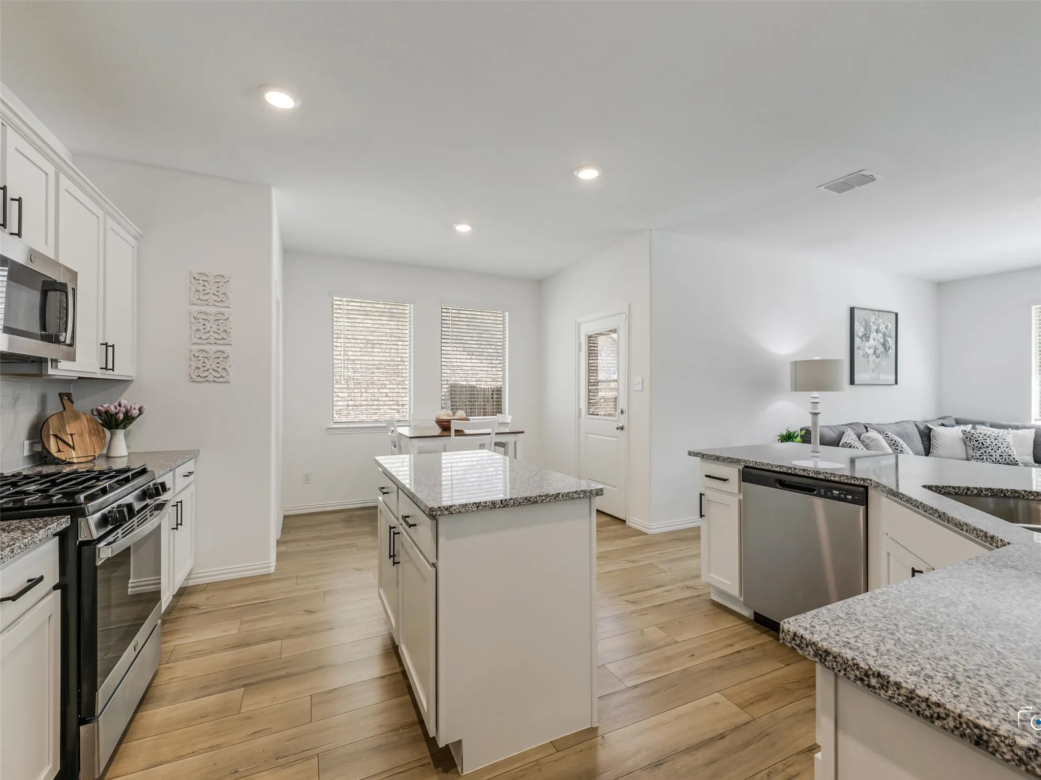 GE stainless steel Gas Range, Microwave and Dishwasher, The island offers additional storage and work space