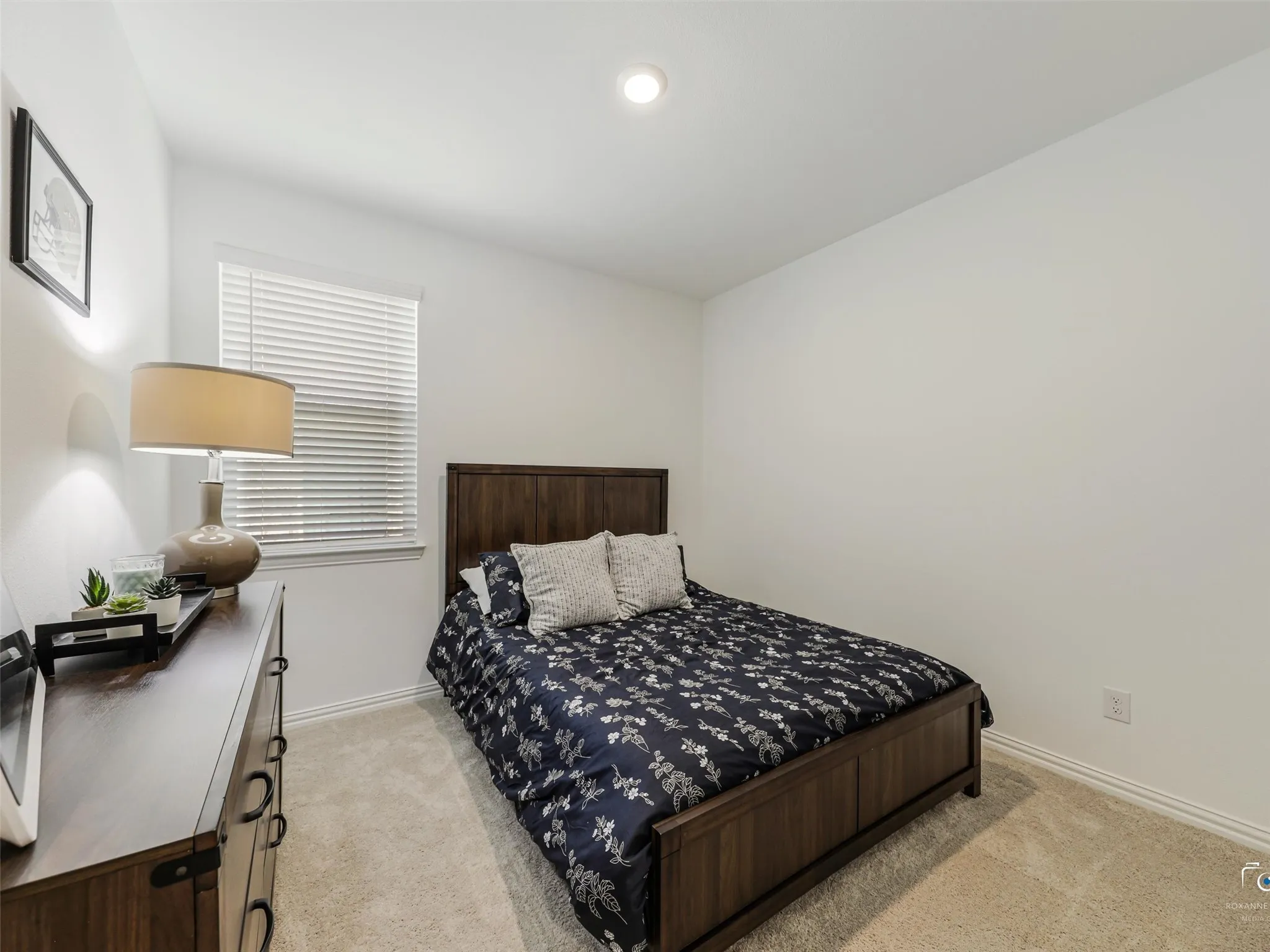 All secondary bedrooms are prewired for ceiling fans. The laundry room is located next to this bedroom