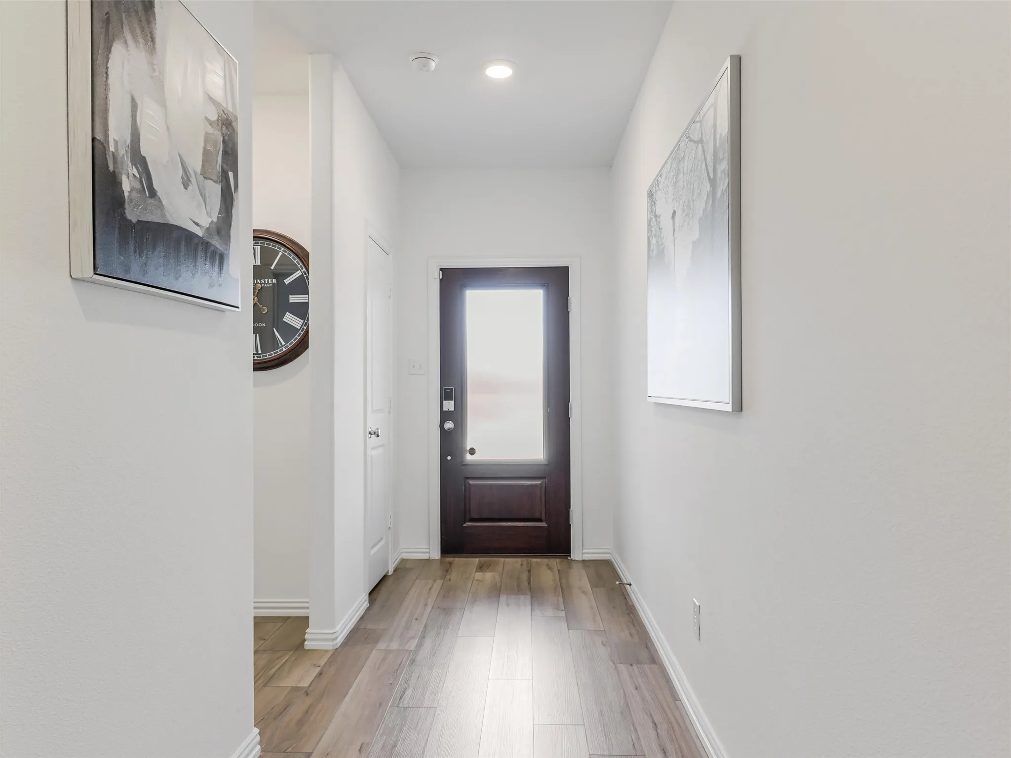 To the left of Front door are 2 of the secondary bedrooms and the second full bathroom. To the right is the 4th bedroom, the laundry room and the door to the garaage