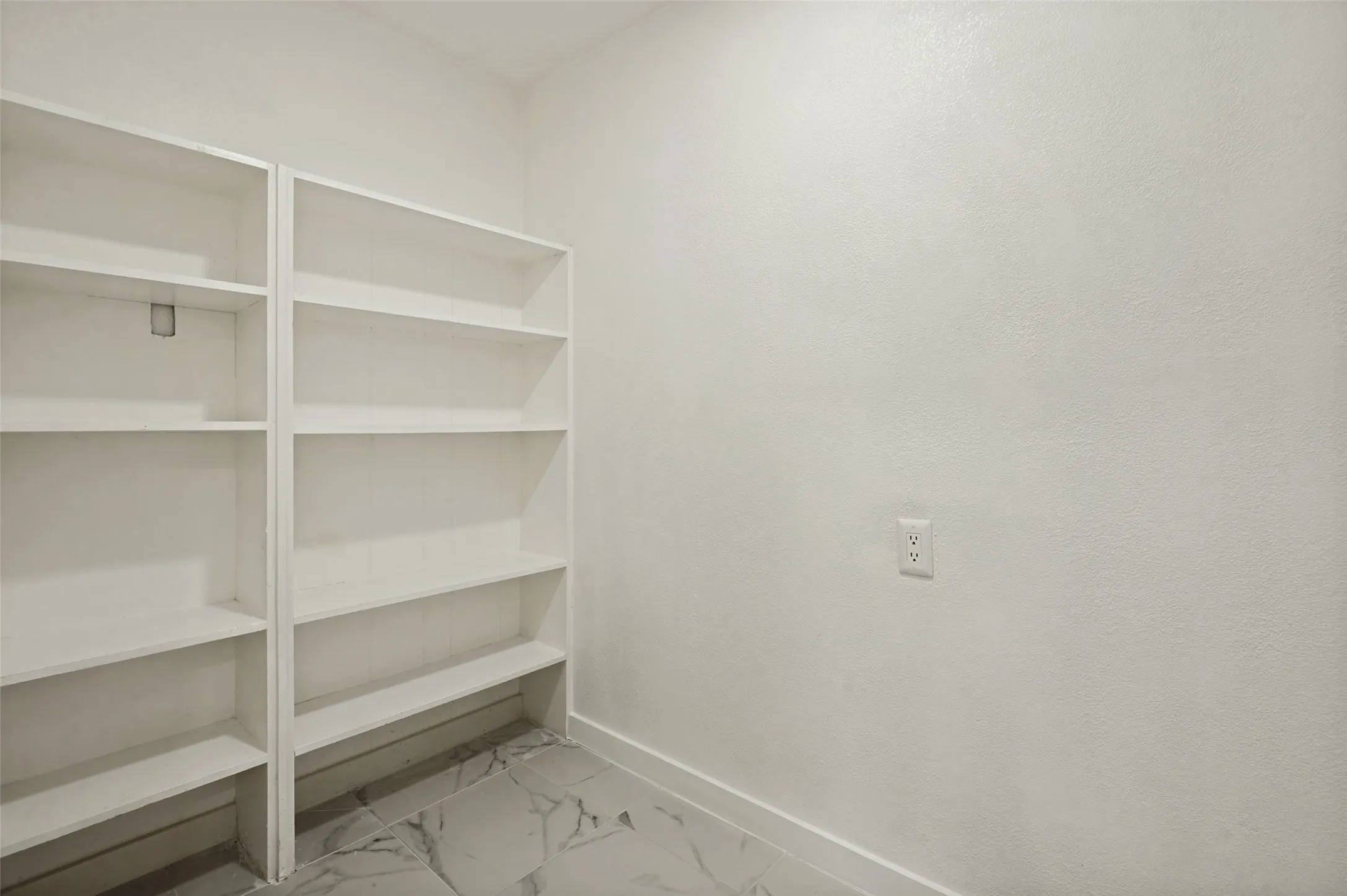 Large pantry with space for second fridge