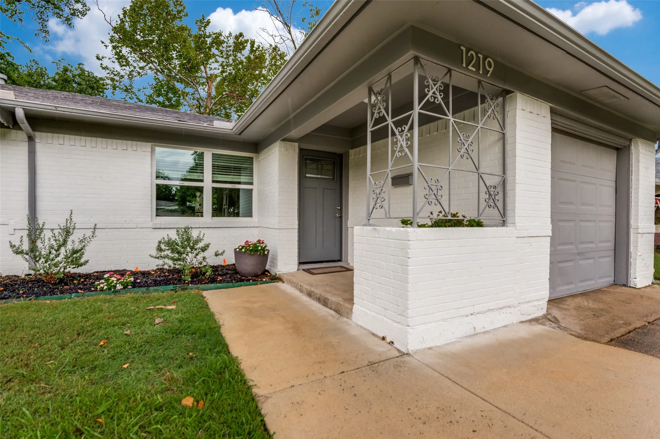 Covered entry and flower bed