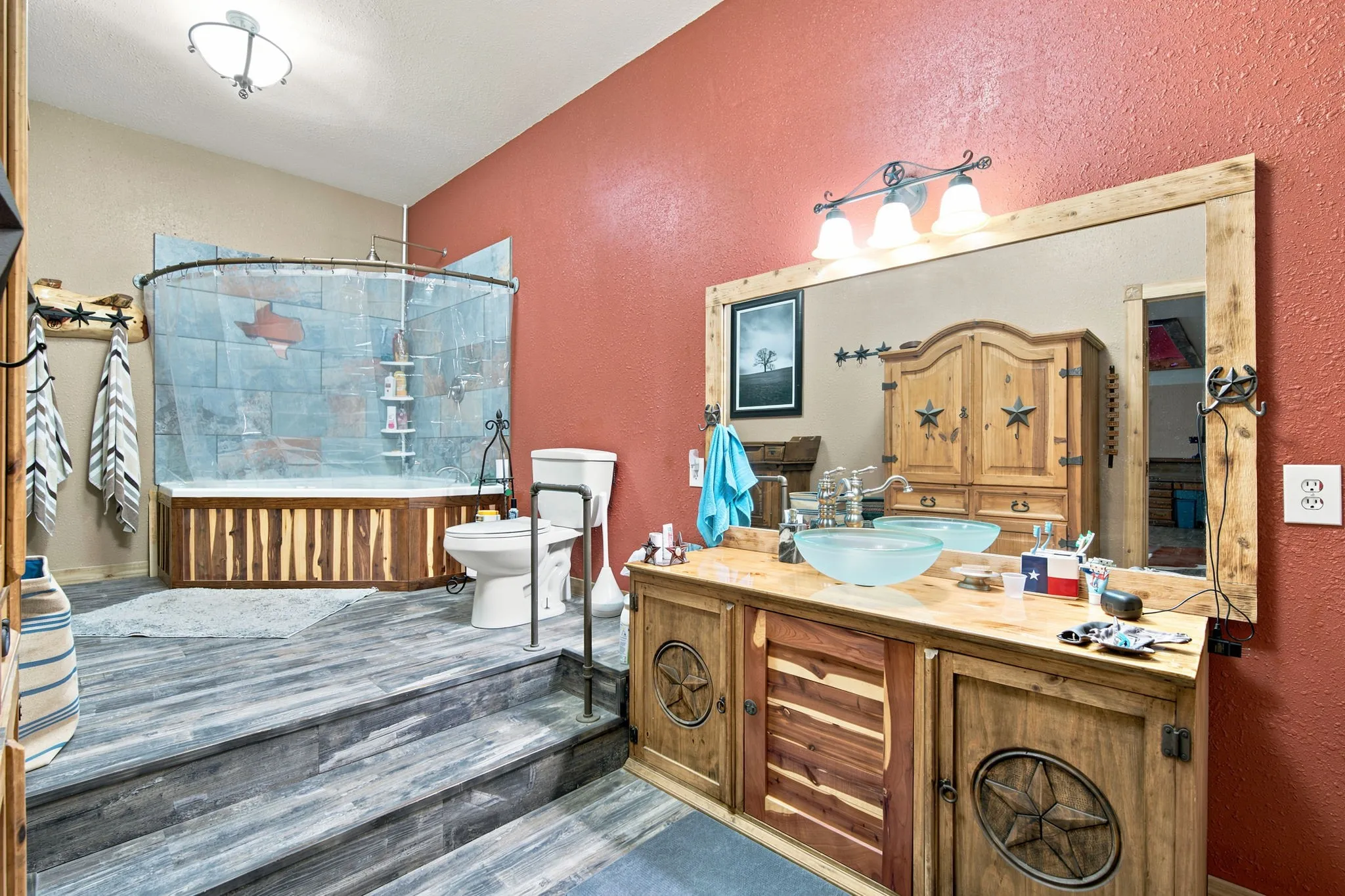 Primary bath features custom cabinets and trim.