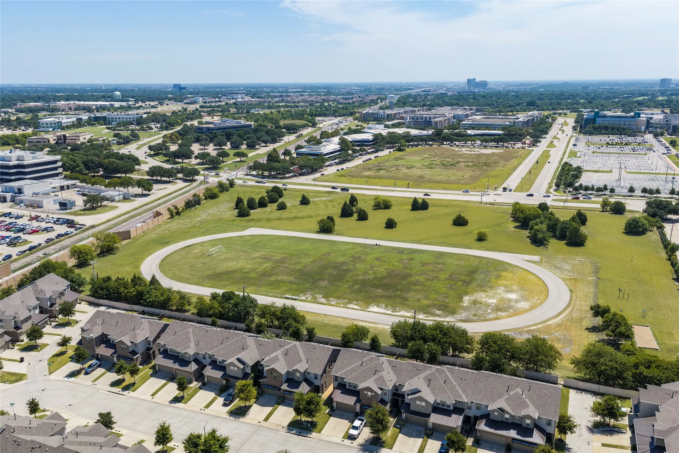 Aerial perspective showcasing a residential development with structured landscaping