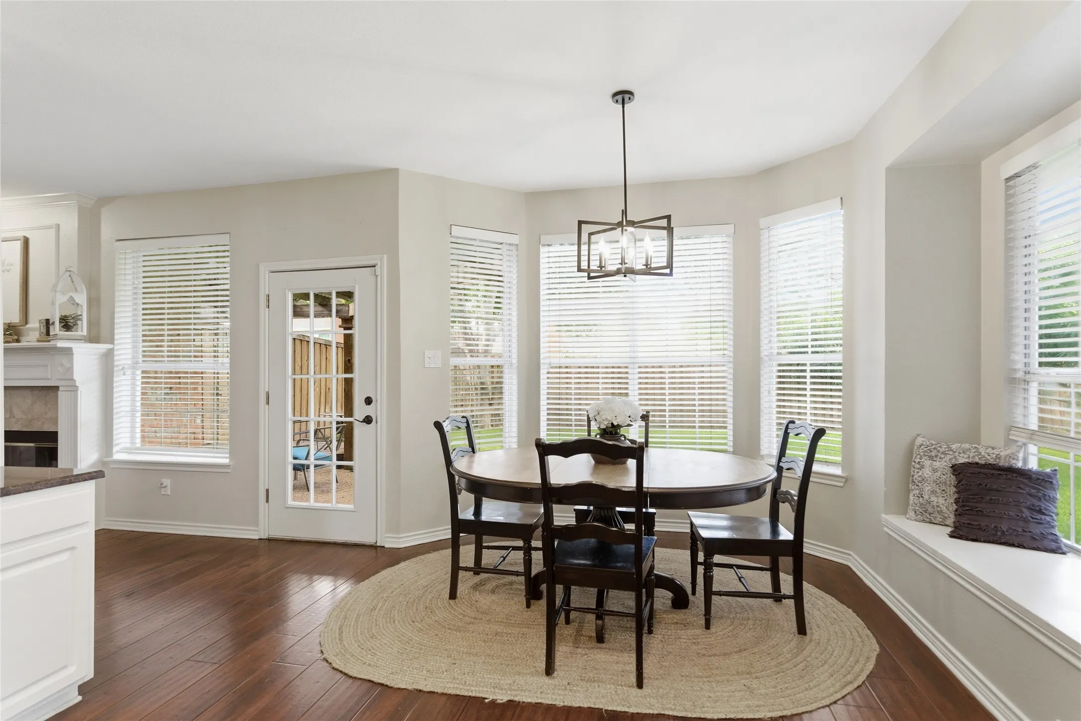 Dining area featuring wood-finish flooring and a built-in window seat