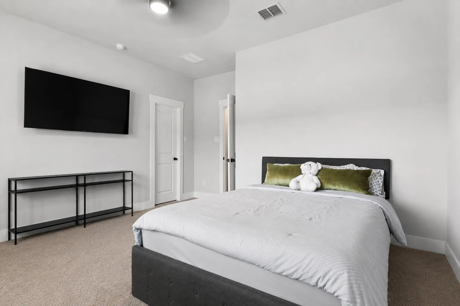 Bedroom 2 Neutral-toned carpeting providing a soft foundation