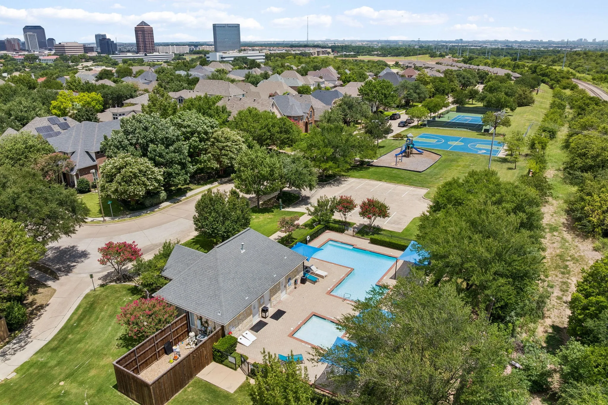 Community park with pool, tennis court, playground and basketball court