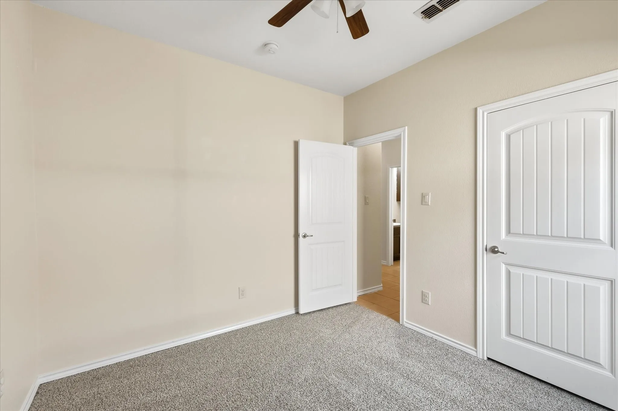 Neutral wall finishes with crisp white trim