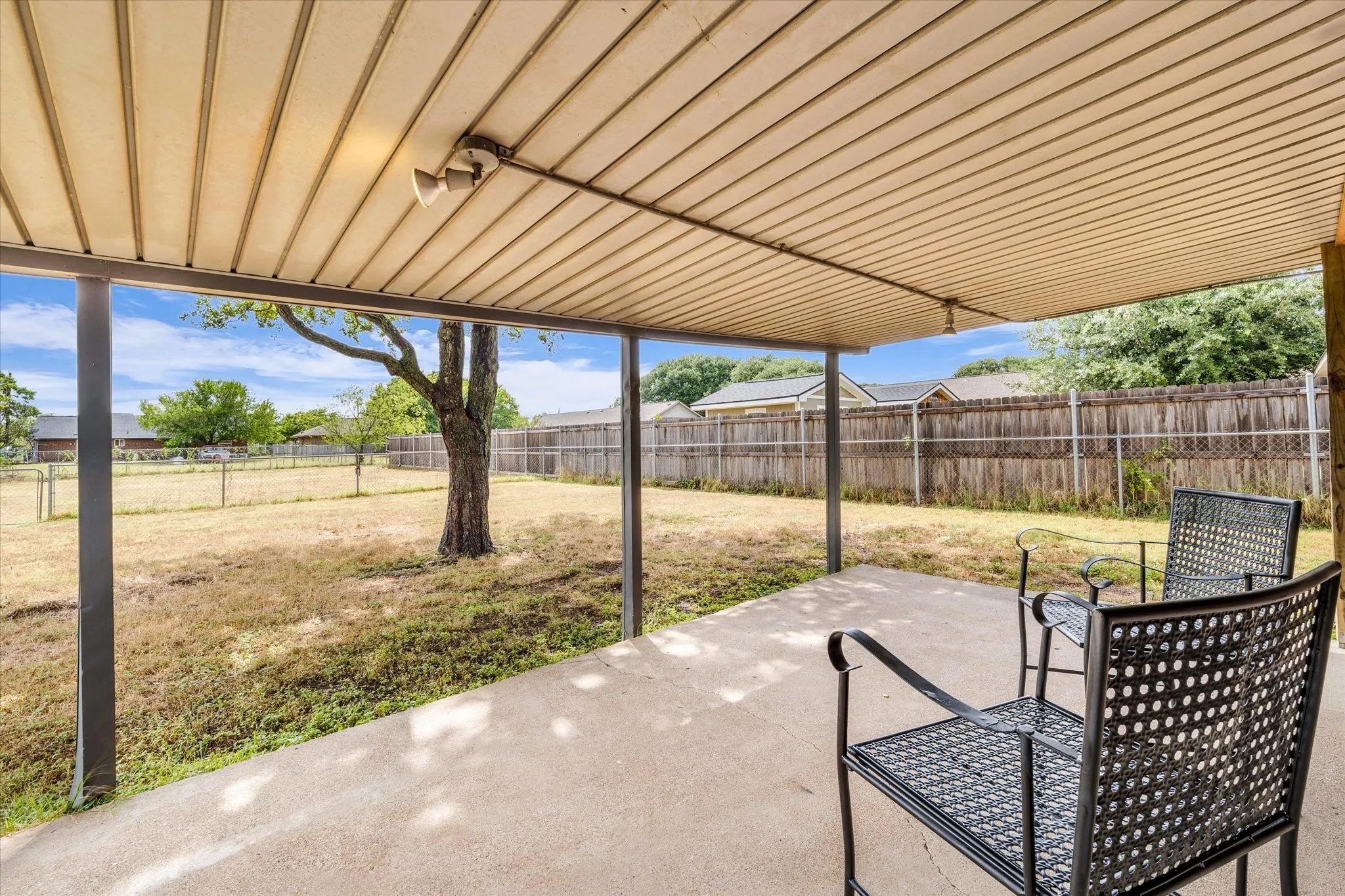 Covered Patio overlooks back yard