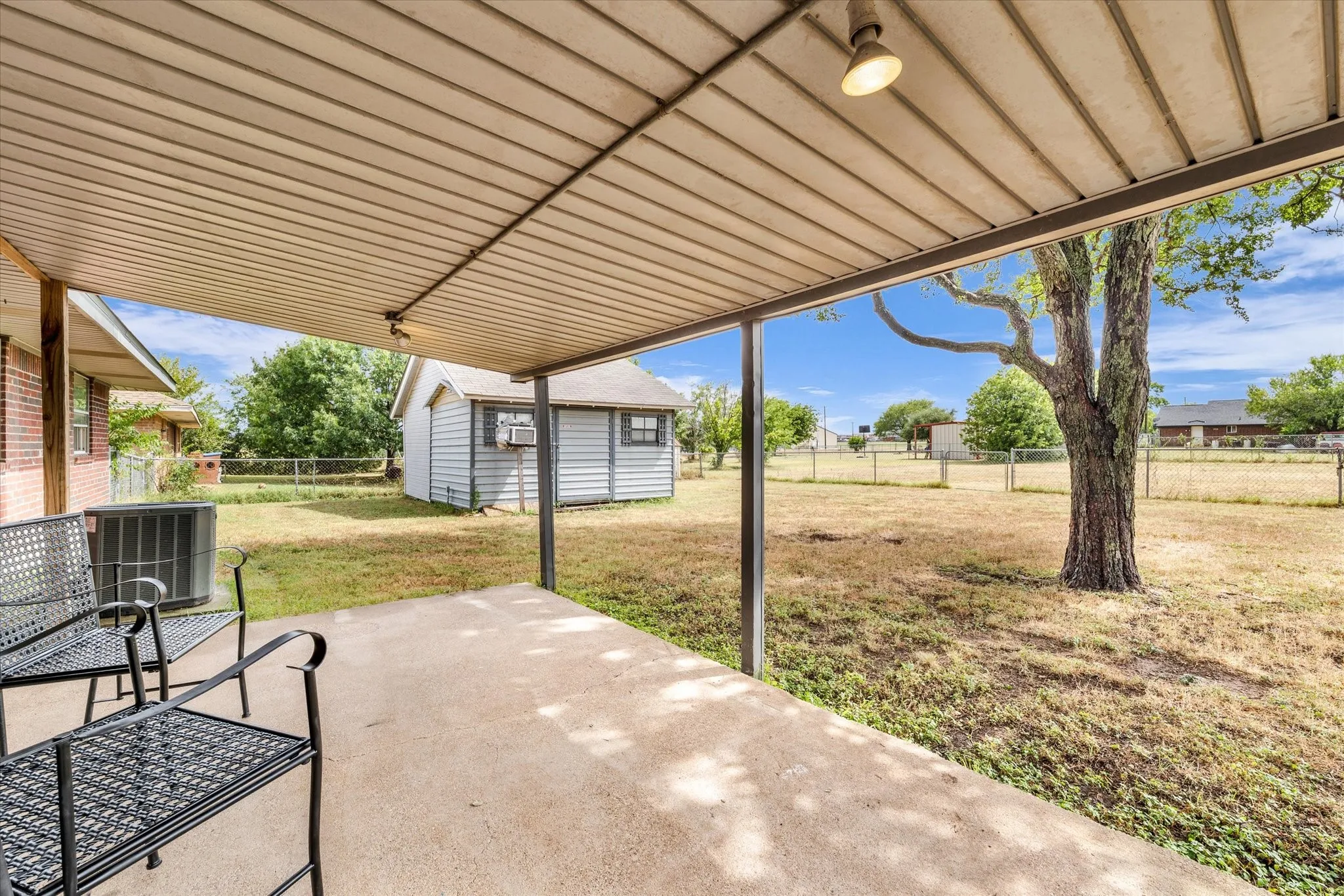 Covered Patio overlooks back yard