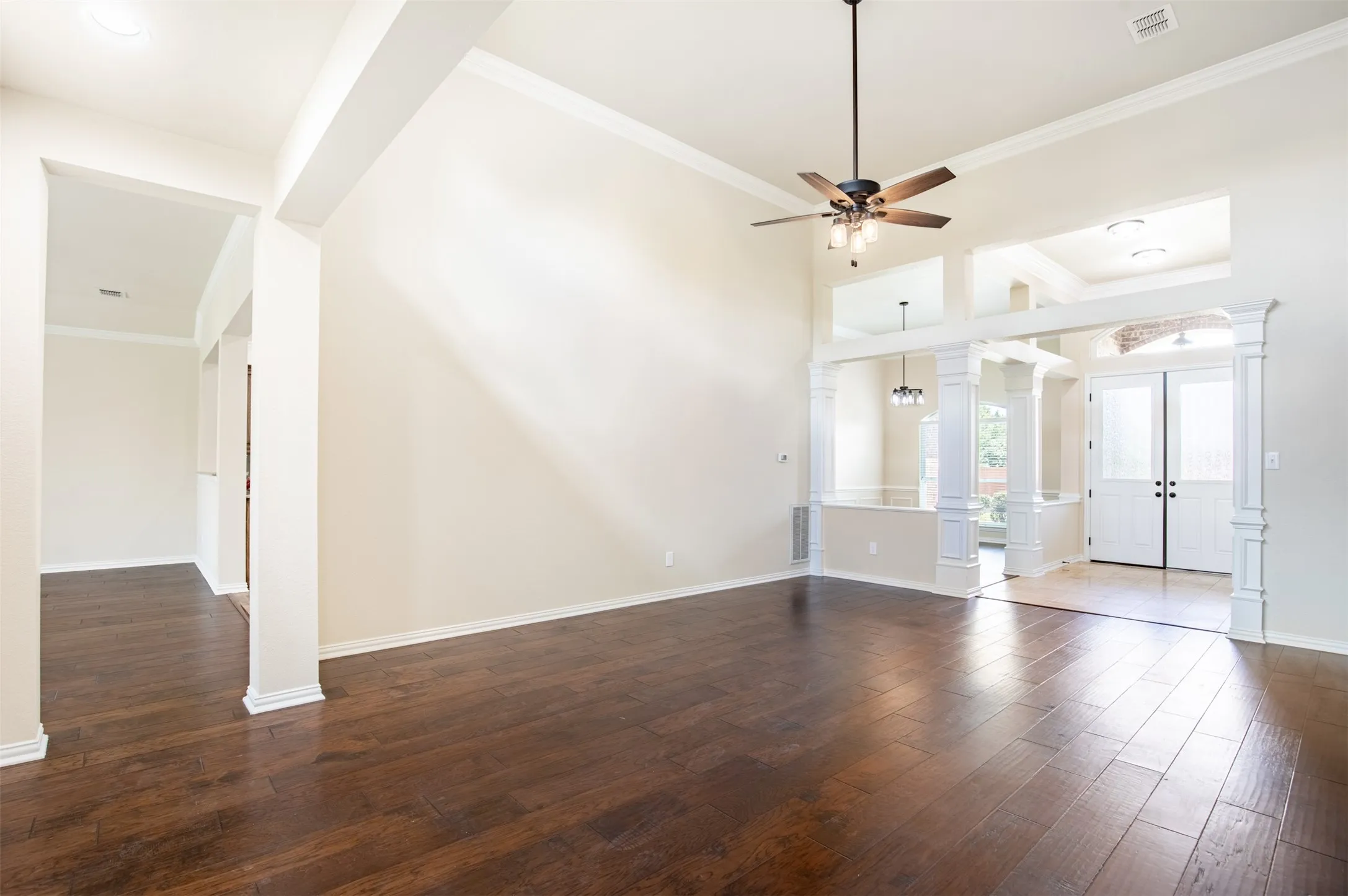 Living room flows seamlessly to kitchen, family room, and dining area.