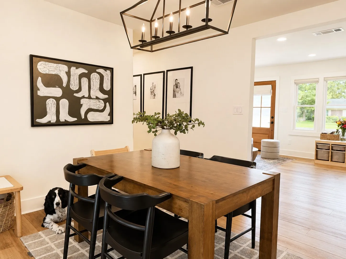 Dining area featuring wood-finish flooring, a contemporary black metal chandelier, and recessed lighting