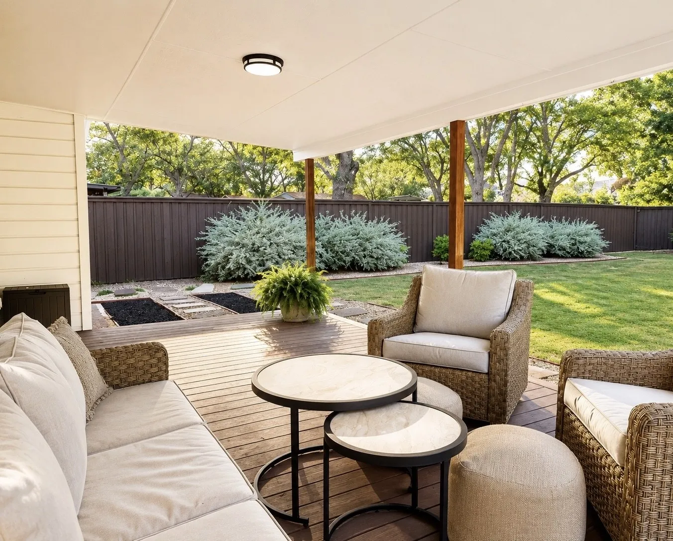 Expansive covered patio featuring wood-finish decking and a ceiling-mounted light fixture
