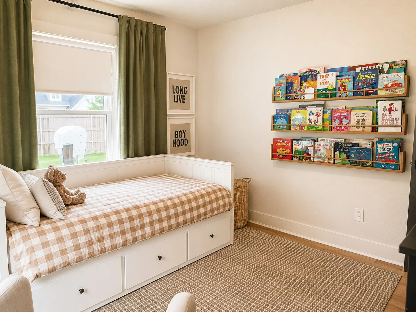 White walls featuring three wall-mounted wooden shelves, a double-hung window with a roller shade, and green curtains on a black rod