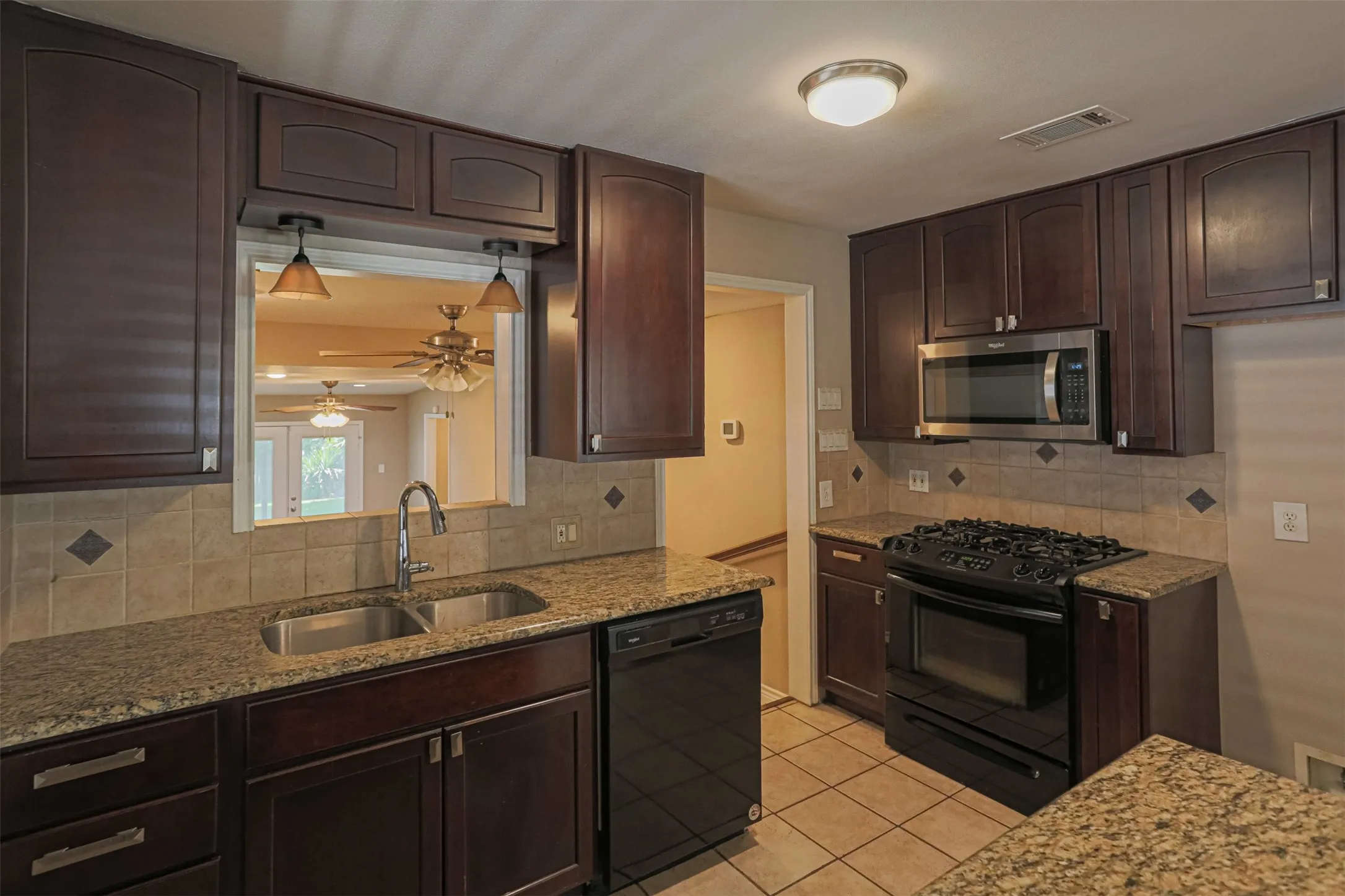 Additional kitchen perspective showcasing generous cabinetry and functional design.