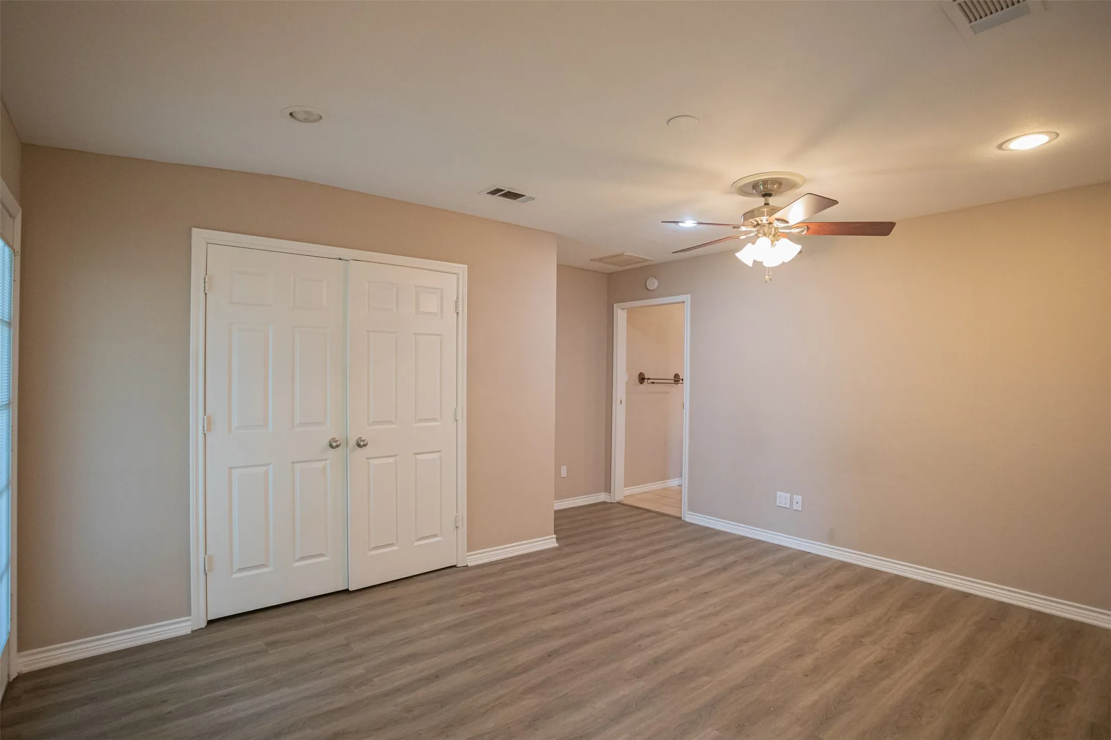 Primary bedroom with versatile bedroom layout
