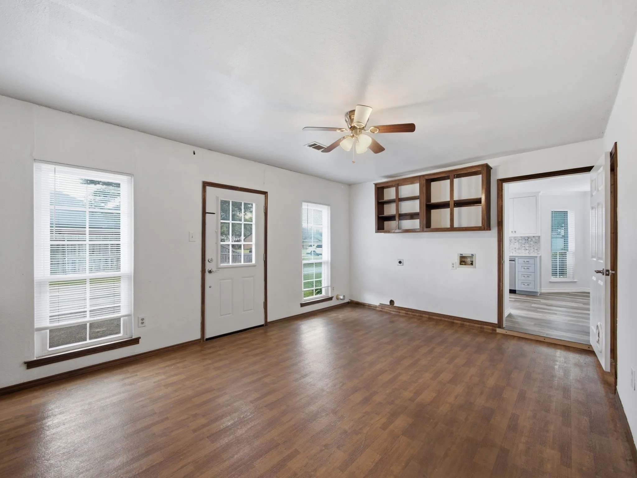Oversized laundry room with built in cabinets