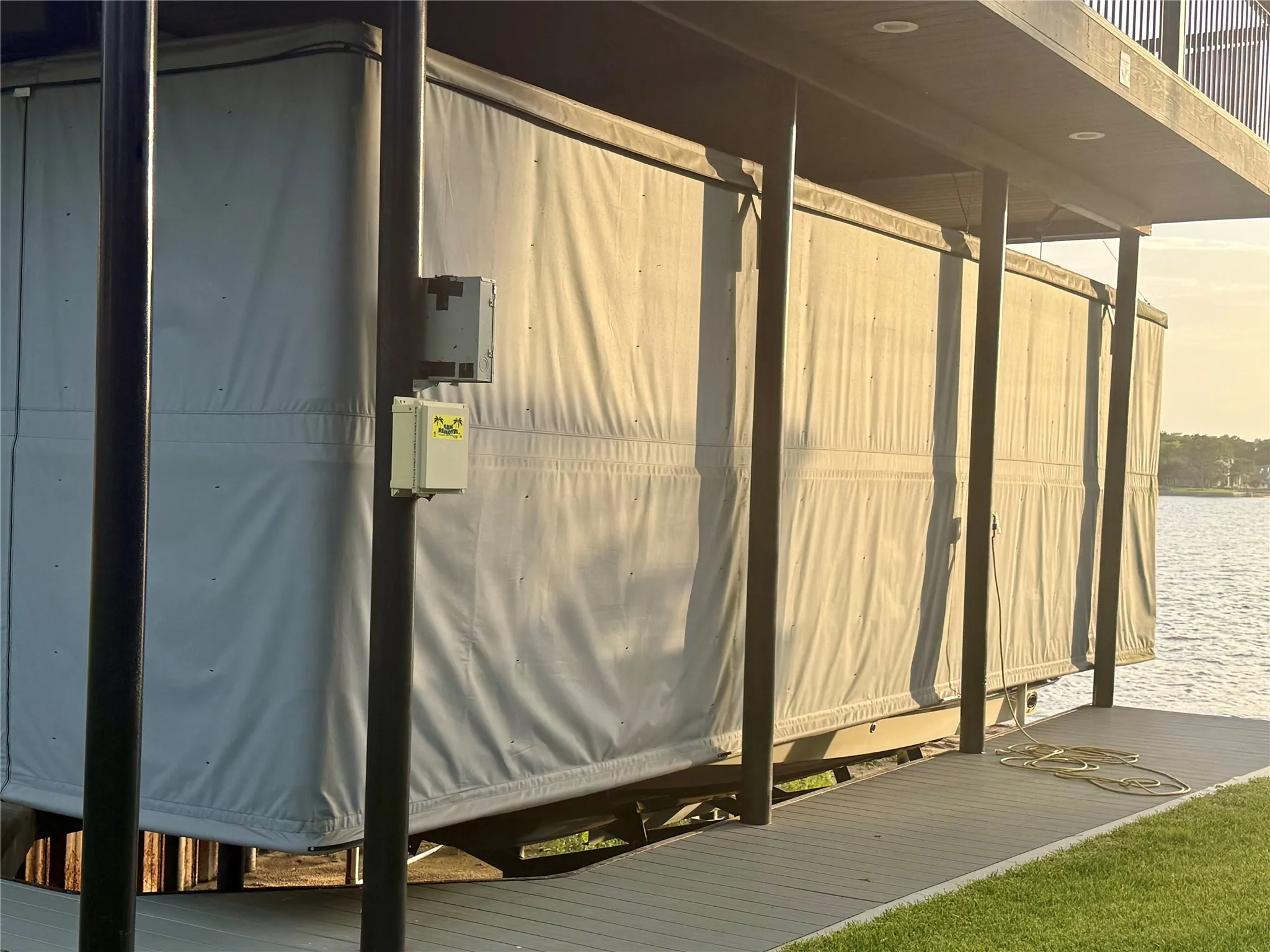 Boat house has composite surface, aluminum party deck and full touchless cover.