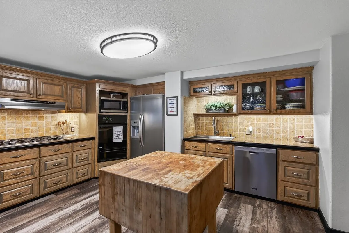 Island kitchen has a full wall of pantry space also with lots of storage.
