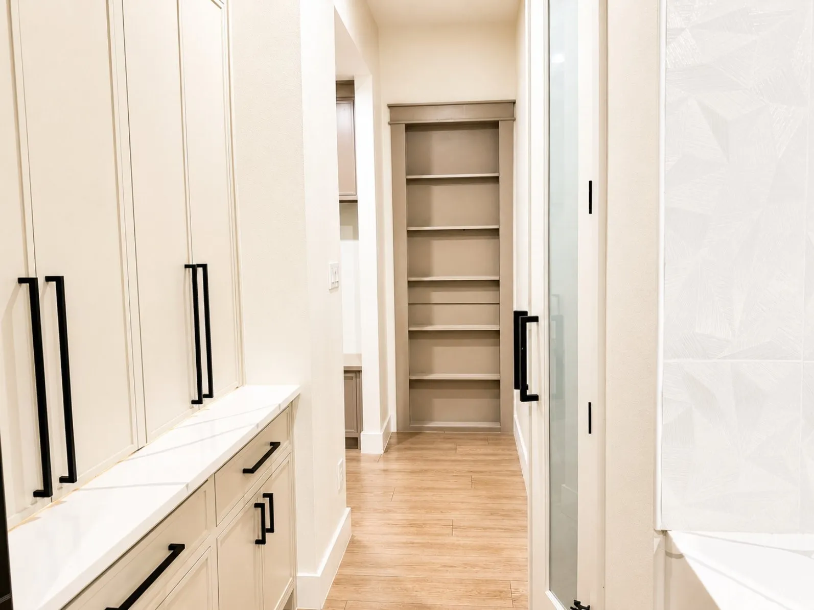 Hallway to kitchen pantry, mud room, and laundry room
