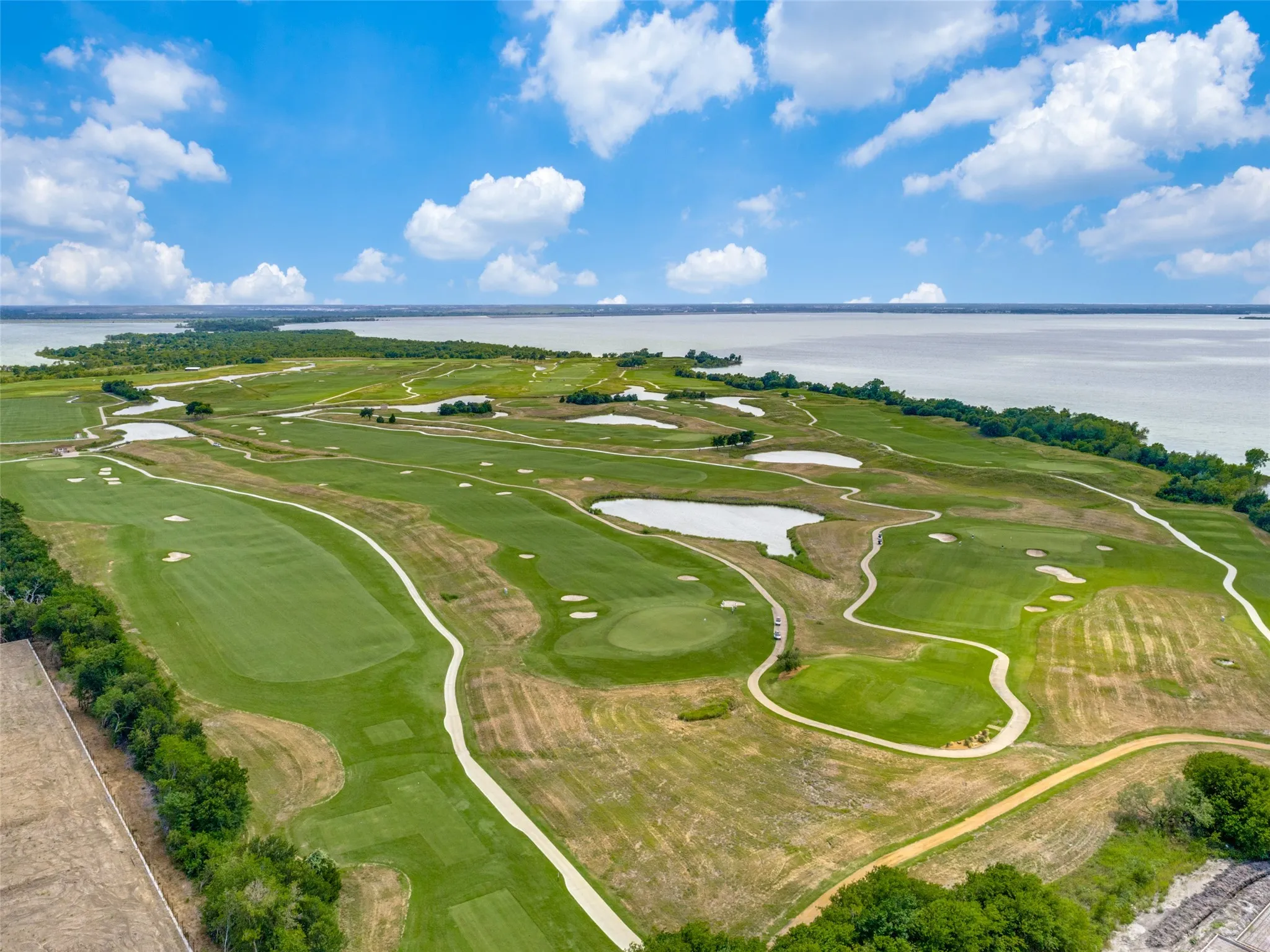 The Tribute was designed around two first class golf courses.  Golfers can choose between The Tribute Golf Links and The Old American "Club course".  The Tribute course is modeled after the legendary courses of Scotland, and the Old American course has a design reminiscent of early American courses.  Together they offer 36 holes of exciting golfing with lake views.  The Tribute Clubhouse - open to anyone in addition to golfers -  offers a Pro shop, dining and patio seating.