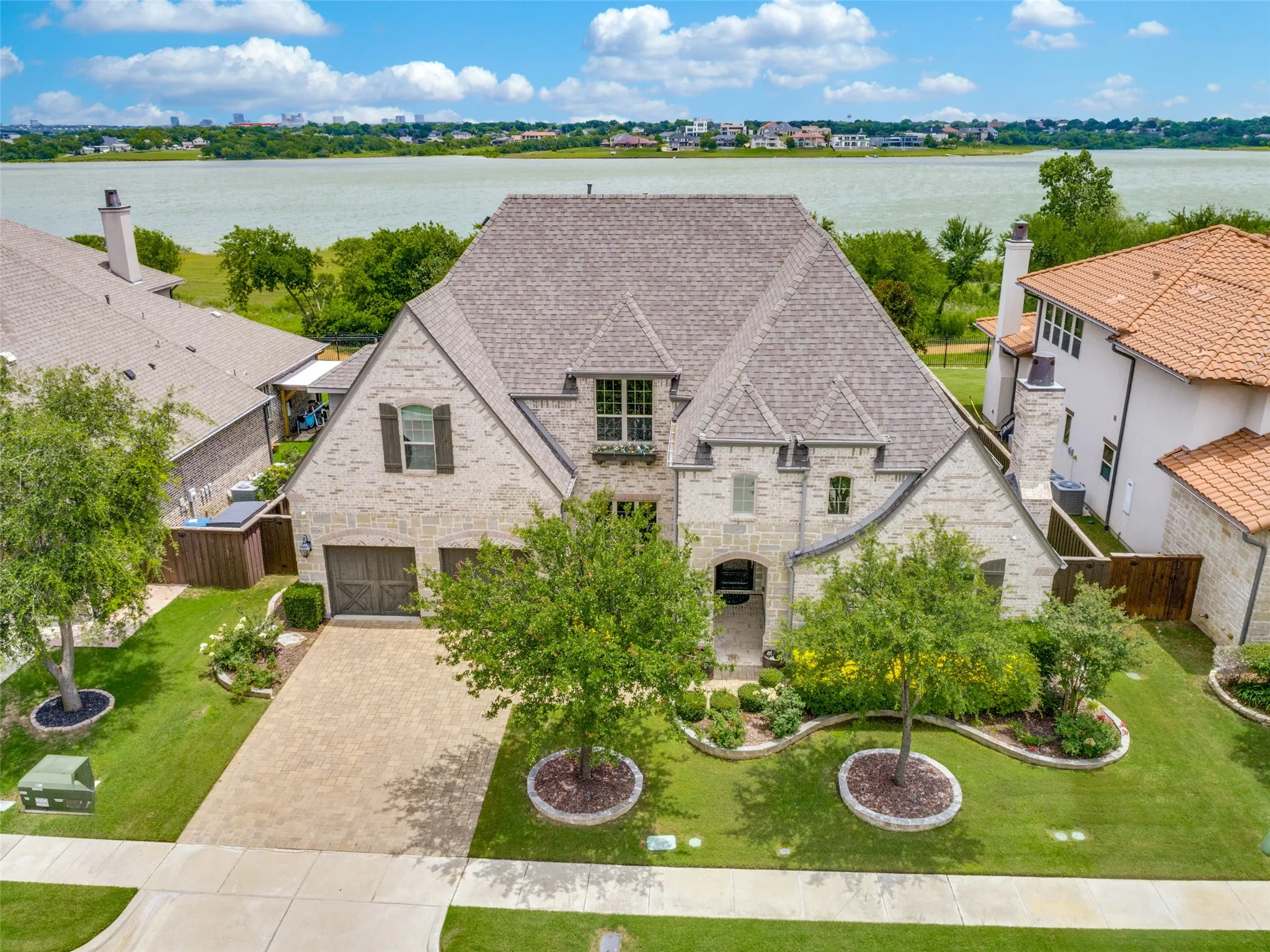 If location is the king, then this house wears the crown!  Backing to a peaceful cove in Lewisville Lake with a home of this quality is a rare opportunity in this price range.  Privacy and views of greenery and the lake really make this home appealing.  The three car tandem garage is oversized and has epoxy flooring.